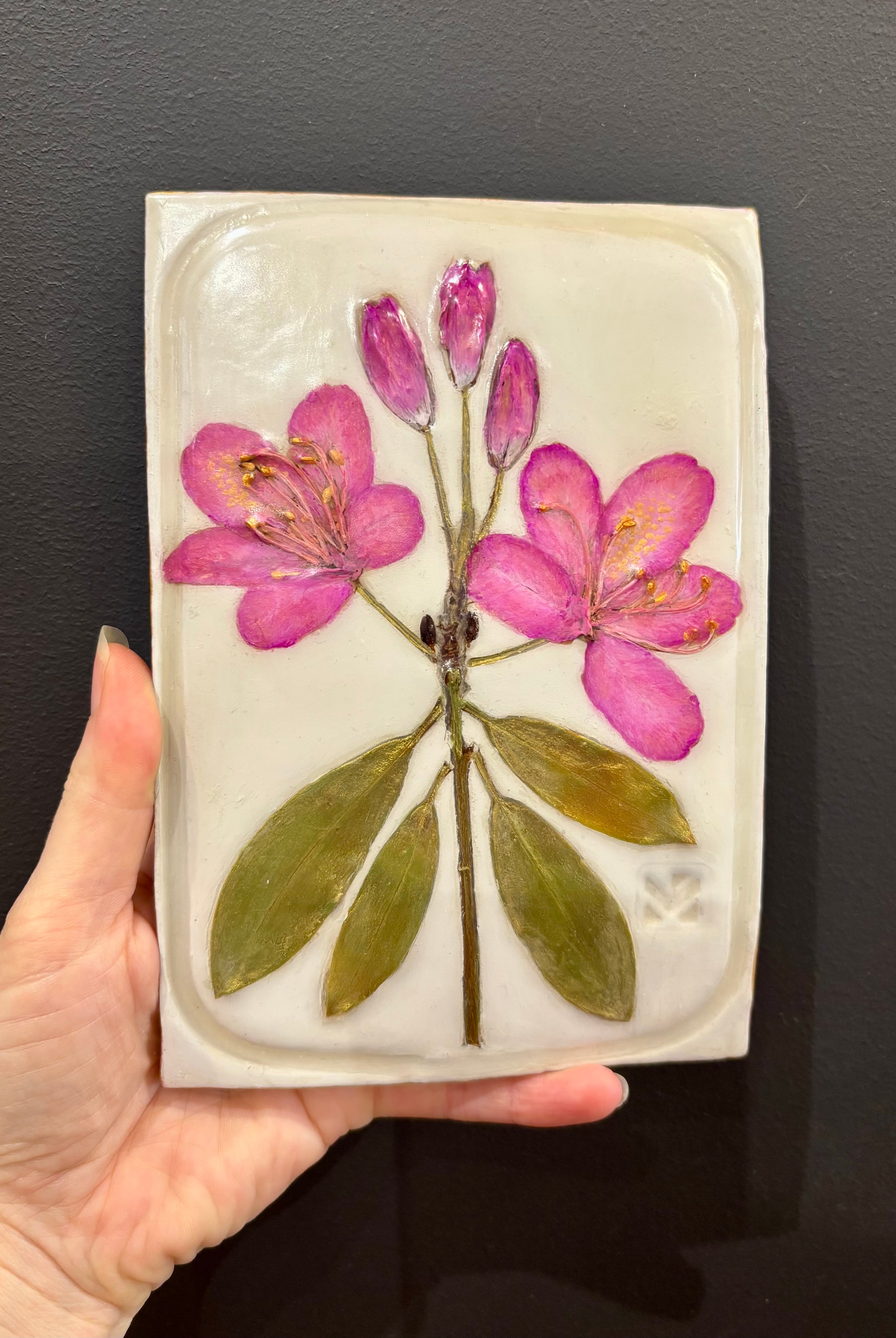 A rectangular ceramic tile with botanical pressed pink rosebay rhododendron on cream clay by local NC artist