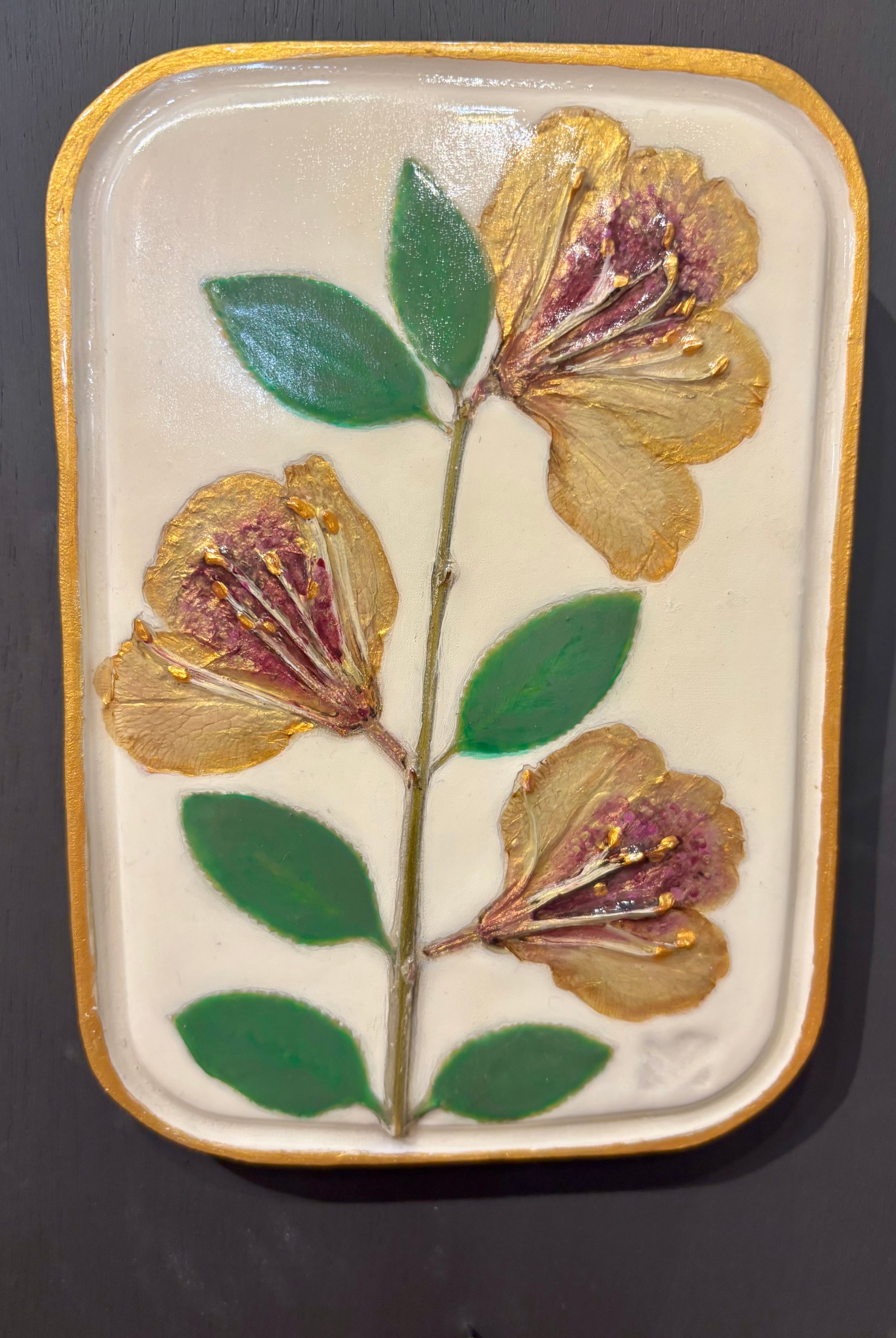 A rectangular ceramic tile with botanical pressed yellow sappora rhododendron on cream clay by local NC artist