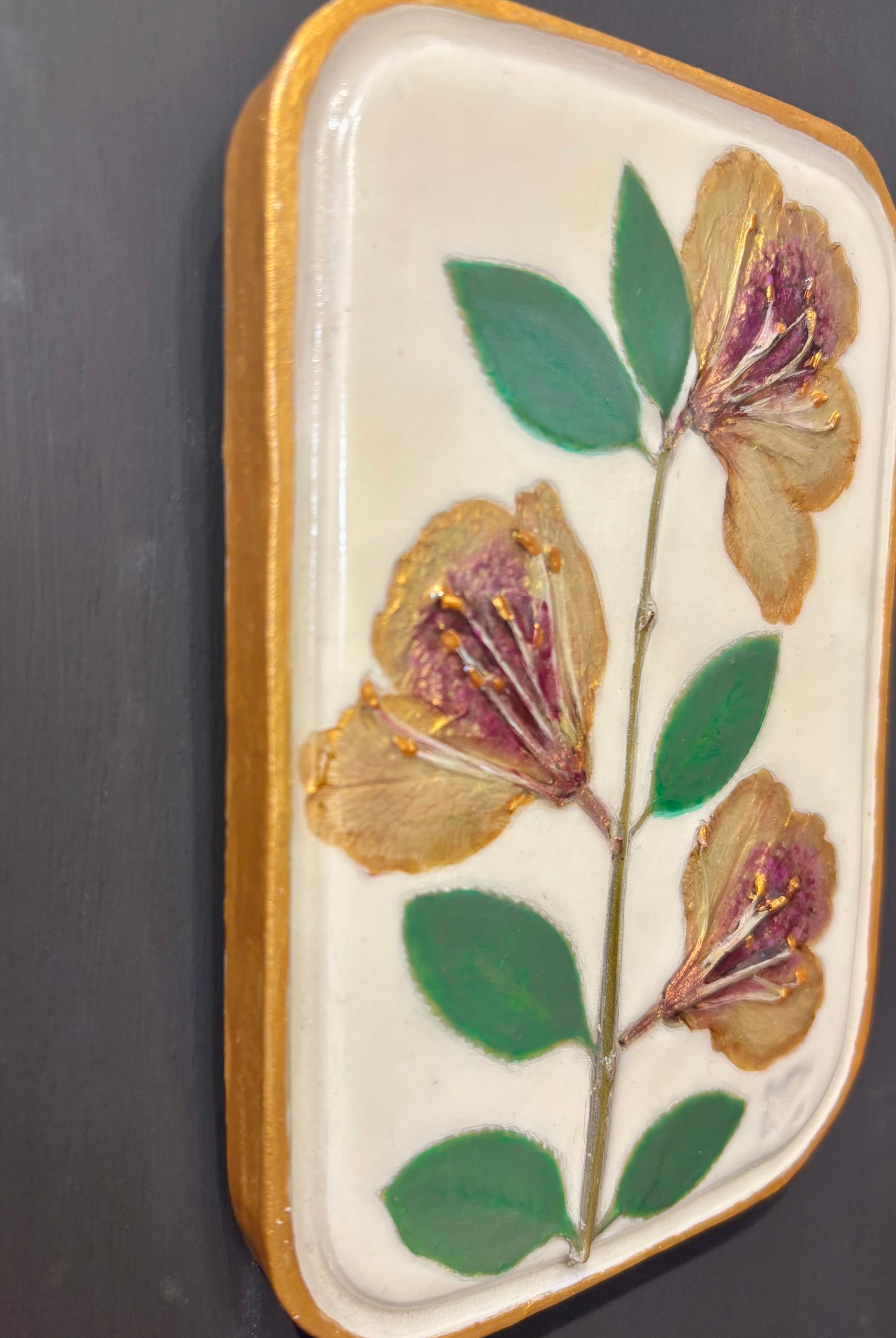 A rectangular ceramic tile with botanical pressed yellow sappora rhododendron on cream clay by local NC artist
