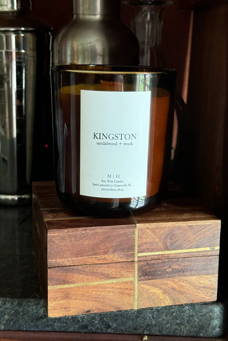 Image of the Southbourne candle hand poured in Greenville South Carolina in a calming blend of sandalwood and soft musk crafted in a glass container with Soy Wax and a wood wick