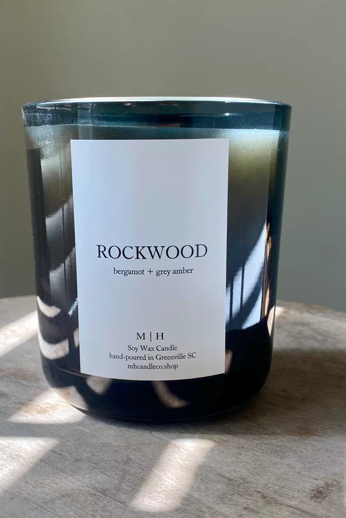 Image of the Southbourne candle hand poured in Greenville South Carolina in a calming blend of bergamot and grey amber crafted in a glass container with Soy Wax and a wood wick