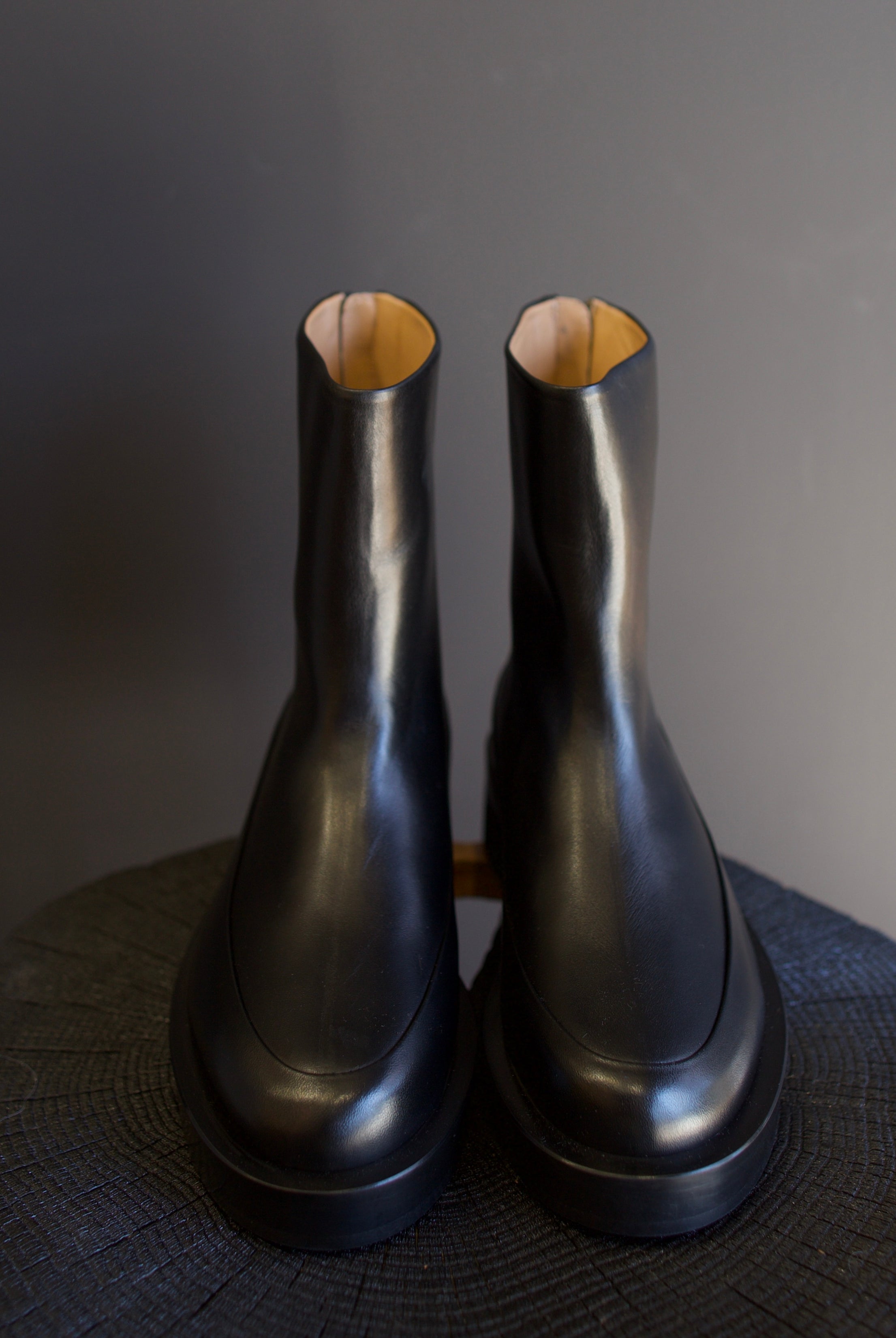 Image featuring The Marion Boot by Mansur Gavriel in black with a round toe, back zip closure and a chunky sole.