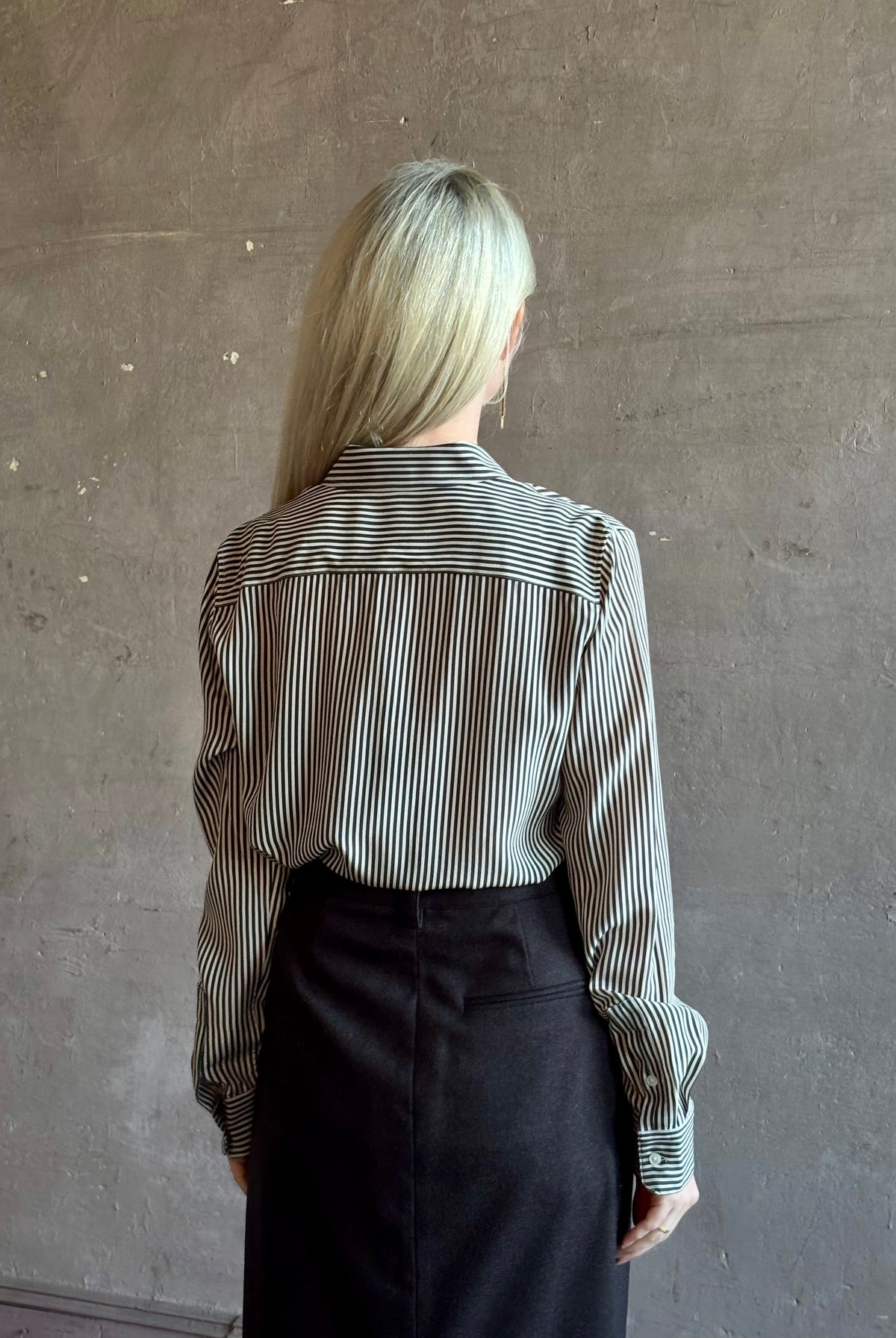 Mature woman wearing Nili Lotan Gaia Slim Silk Shirt in Dark Brown/Cream Stripe button front long sleeve blouse Made in the USA