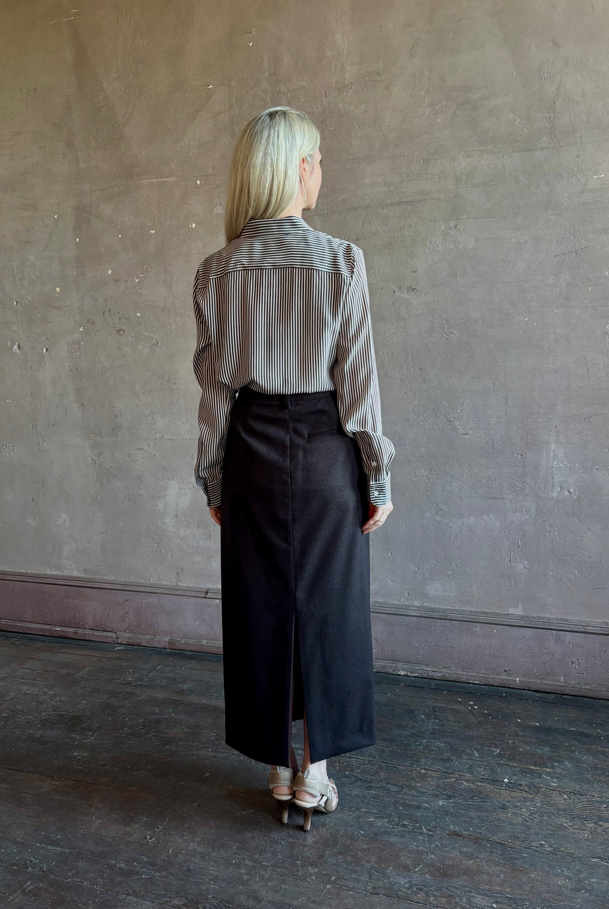 Mature woman wearing Nili Lotan Gaia Slim Silk Shirt in Dark Brown/Cream Stripe classic button front Made in the USA