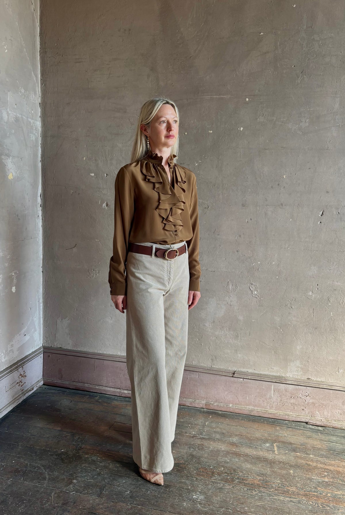 Mature woman wearing Nili Lotan's Lily Long sleeve Blouse Cognac silk delicate front ruffle Warm romantic American-made