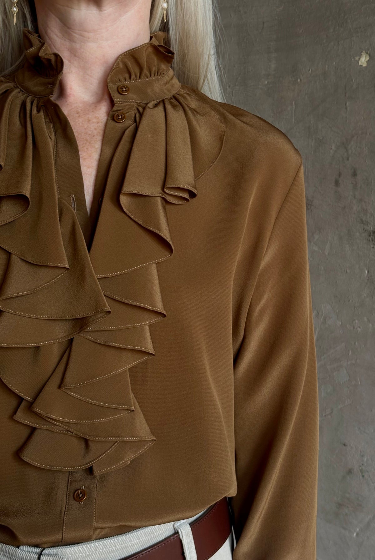 Mature woman wearing Nili Lotan's Lily Long sleeve Blouse Cognac silk delicate front ruffle Warm romantic American-made