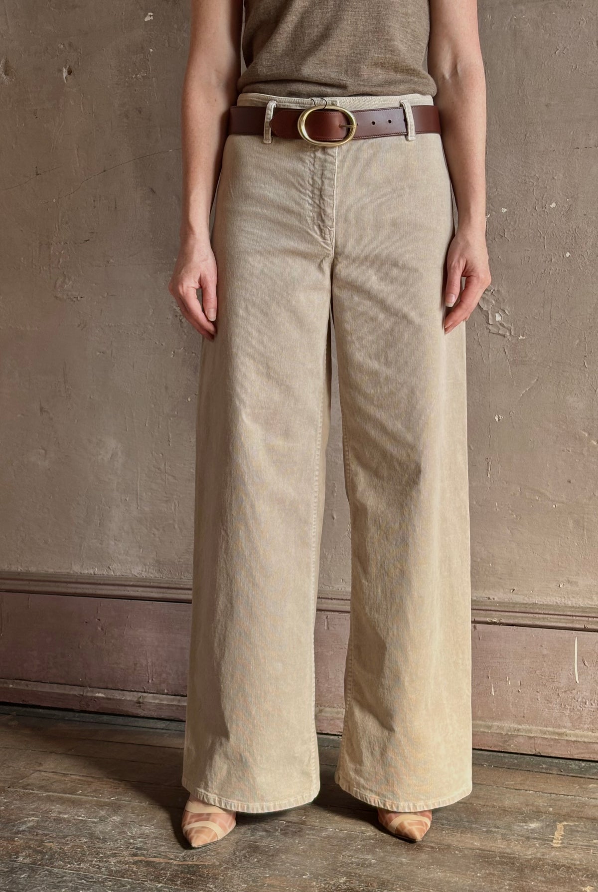 Mature woman wearing Nili Lotan flat front straight leg megan pant in beige corduroy mid rise machine washable cotton