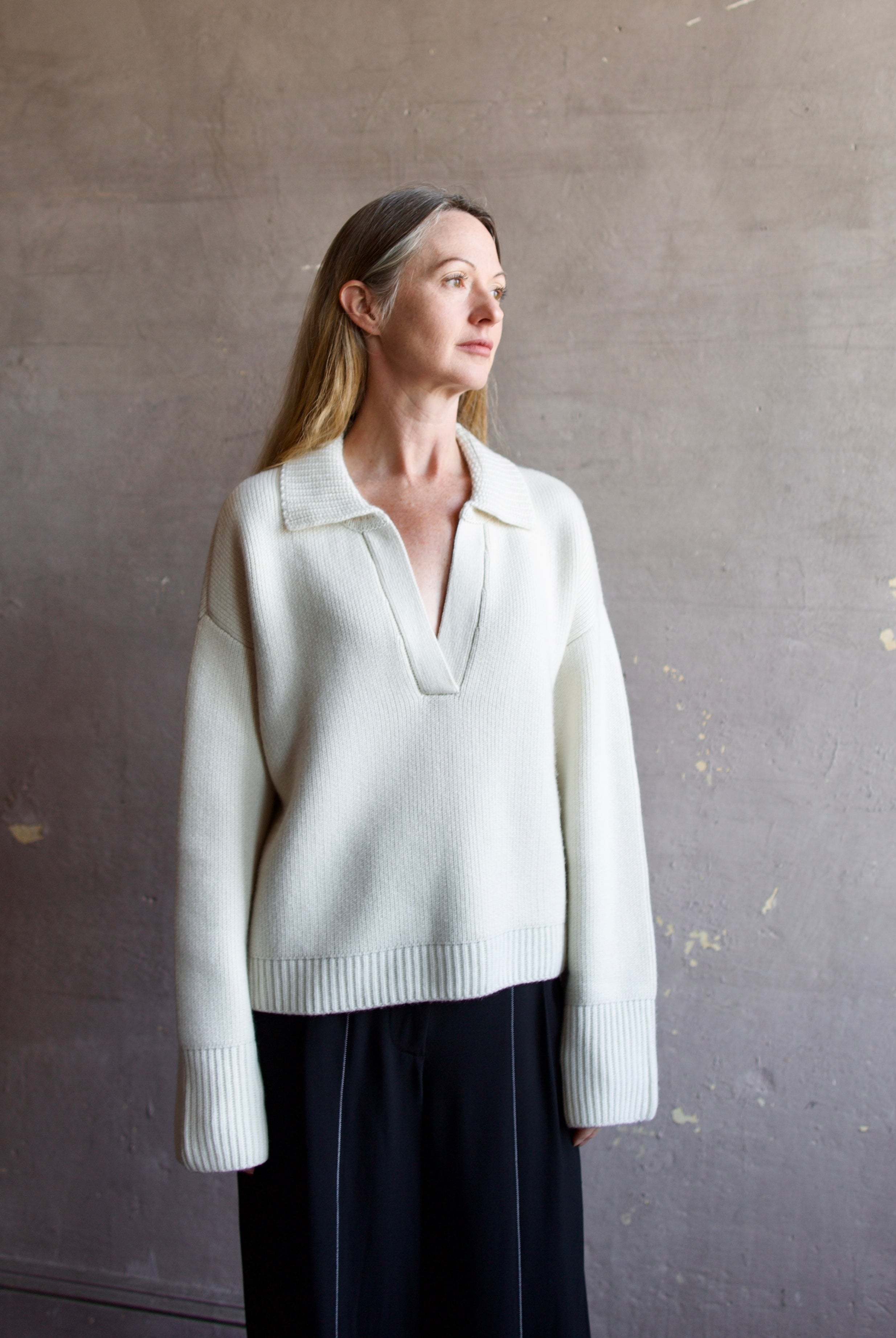 Image featuring a woman wearing this Ultra Luxe Cashmere Polo Sweater by Naadam in cream with a split neckline and collar in an oversized fit.