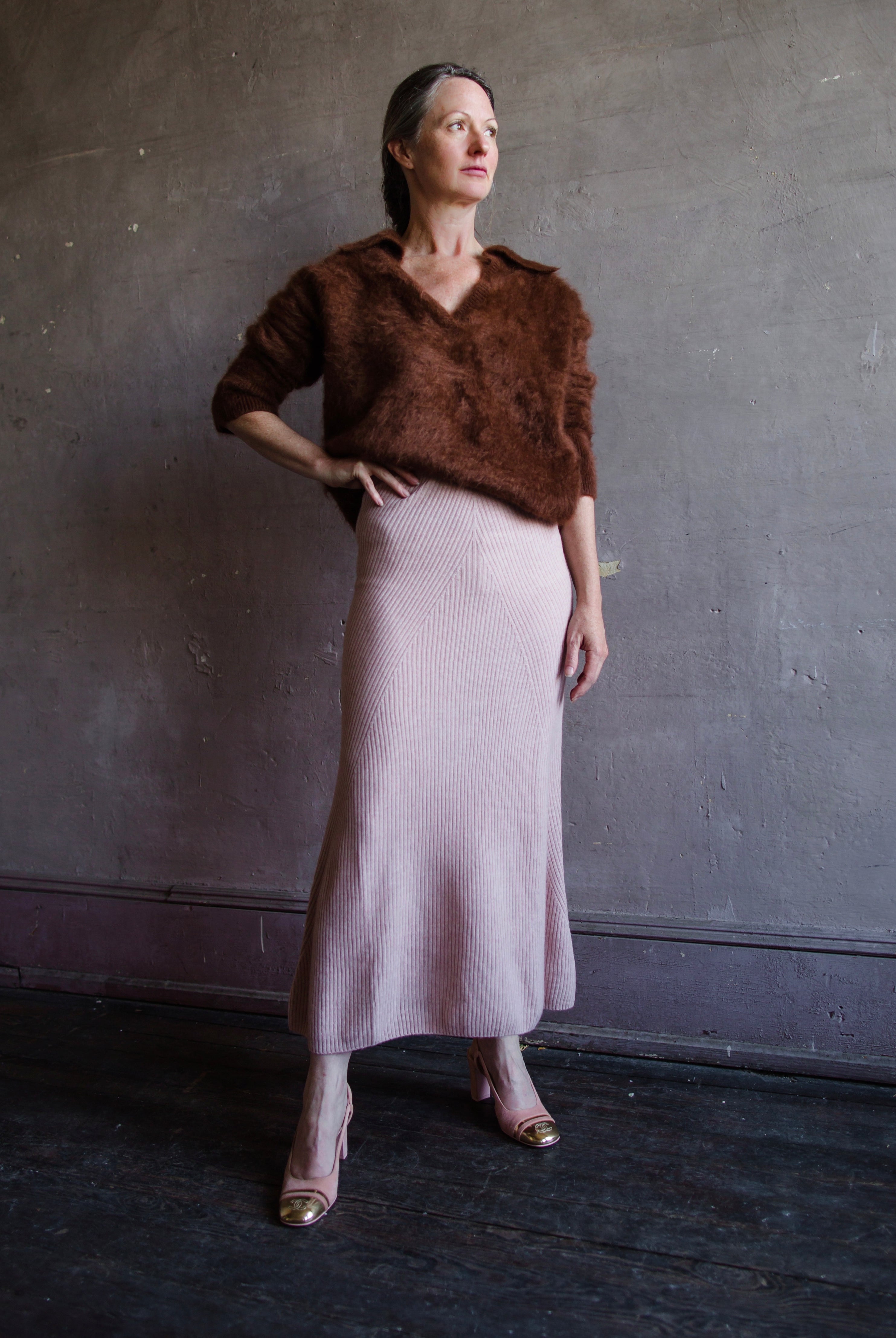 Front view of woman wearing Naadam wool cashmere ribbed everyday skirt