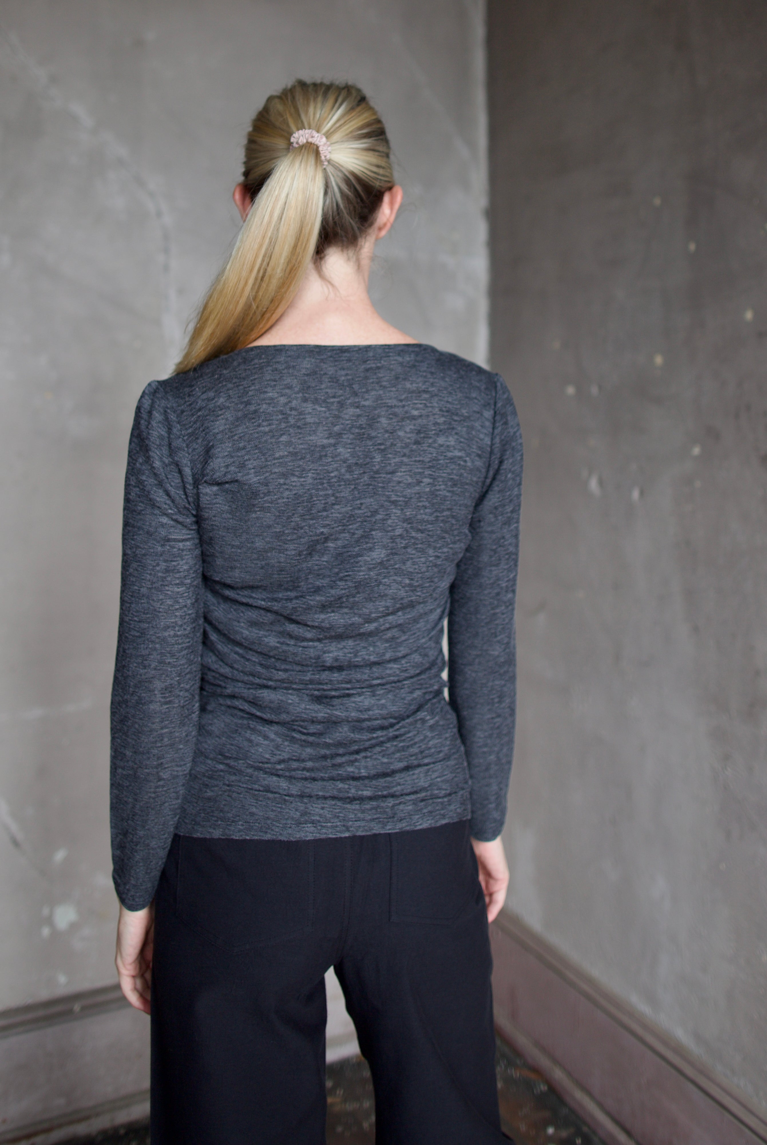 Model wearing Proenza Schouler Blythe Top in charcoal. Top can be reversed front or back offering two different looks.