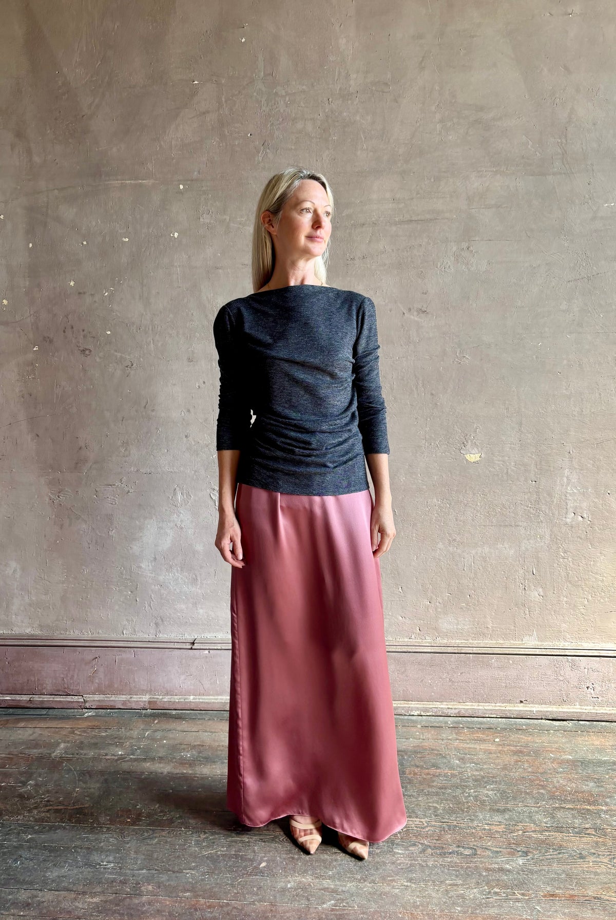 Woman wearing Proenza Schouler Blythe charcoal Top reversable long sleeves wool side ruching luxe draping
