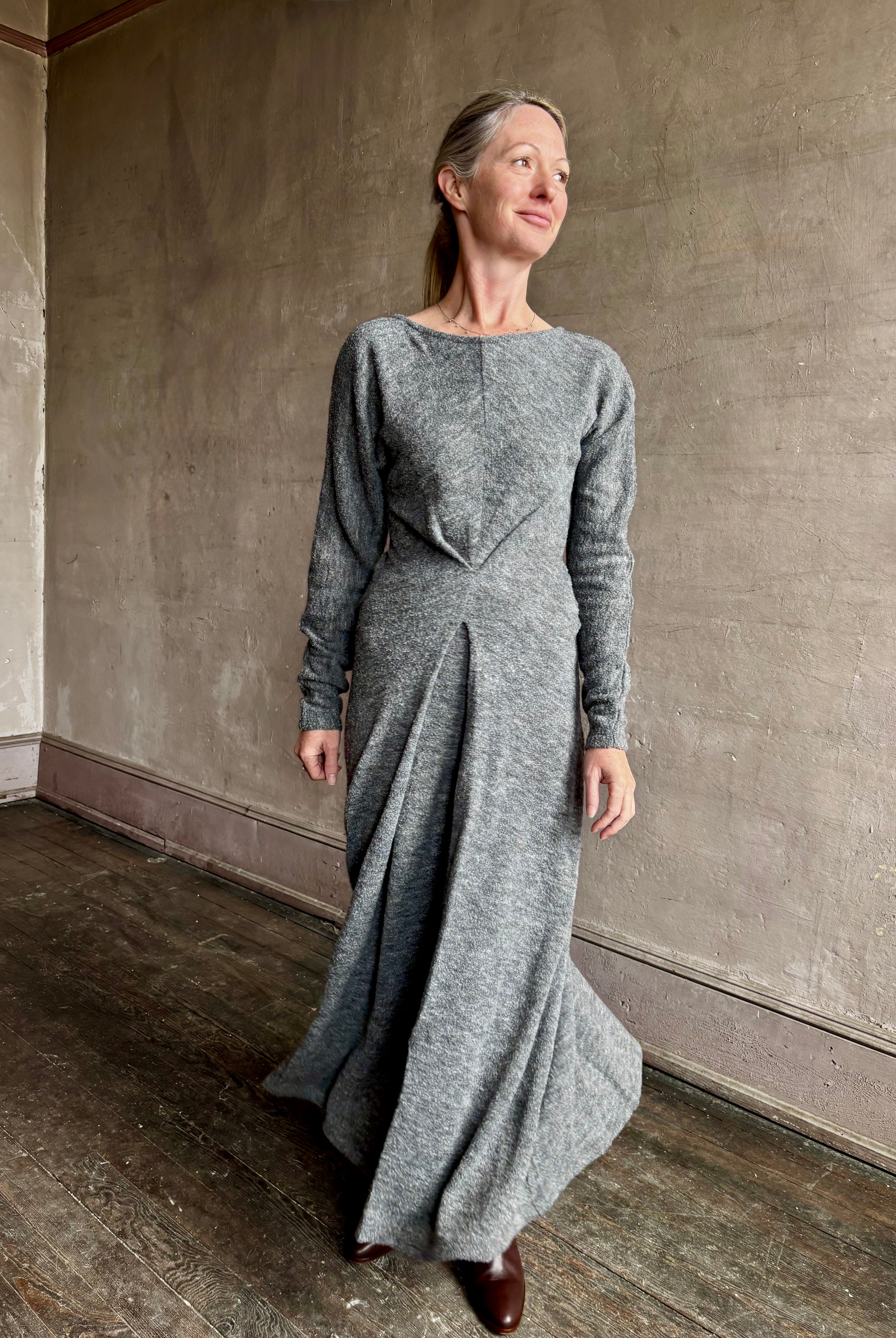 Image of mature woman wearing Proenza Schouler Sai maxi Dress  with a round neckline, long sleeves and tuck-pleated front detailed