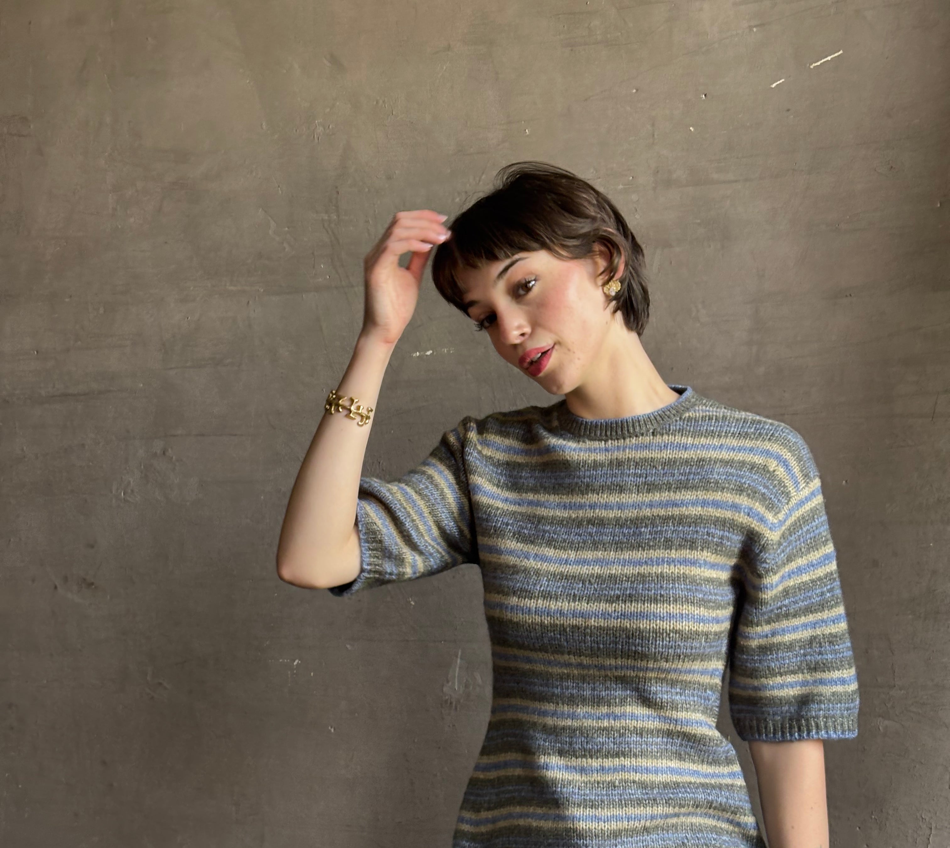 luxury brand Proenza Schoulder Dana sweater with short-sleeve knit top with blue, gray, and beige horizontal stripes
