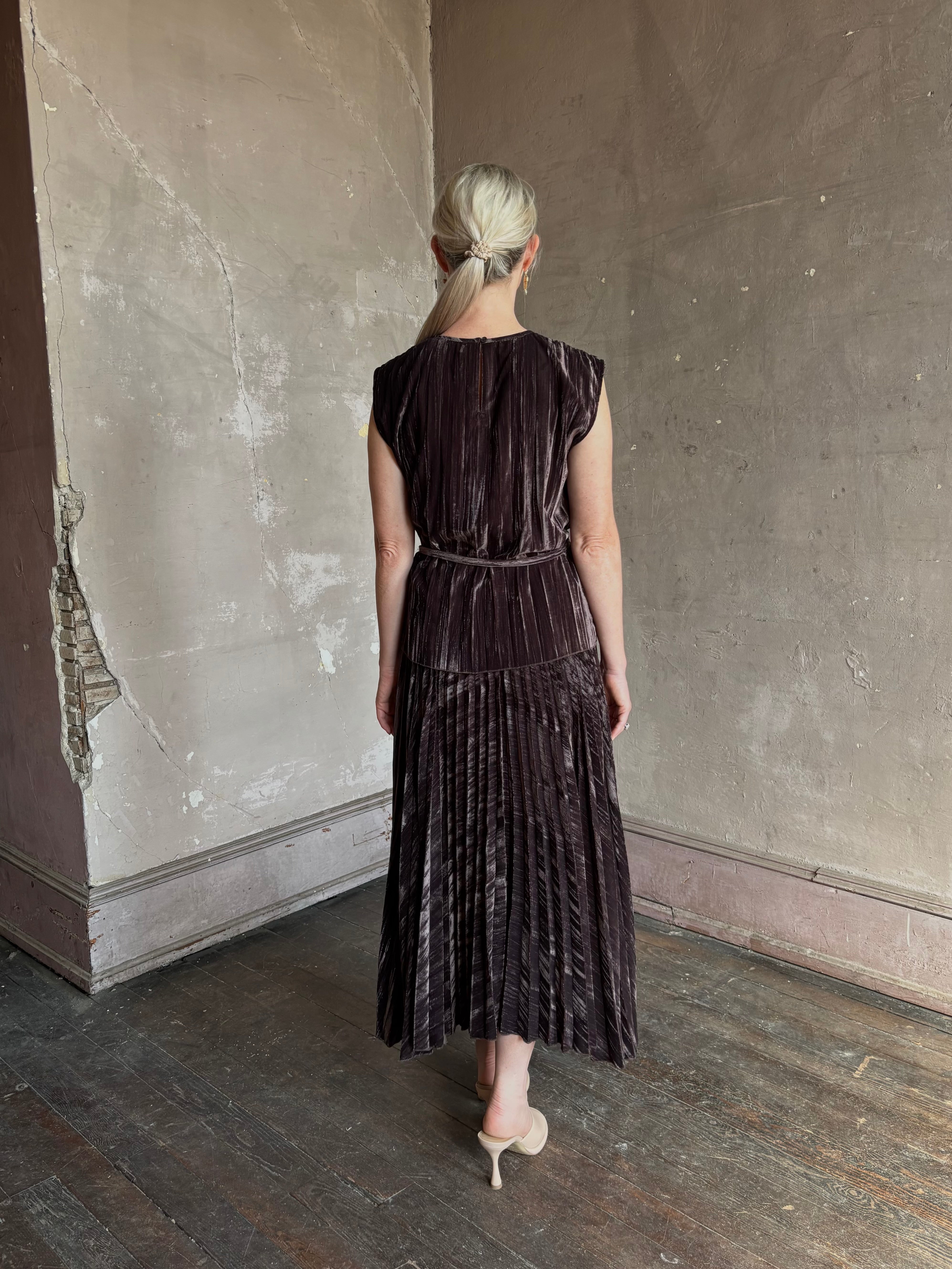 Mature woman wearing Proenza Schouler White Label Daphne crushed velvet Skirt A-line broomstick pleating occasion-ready