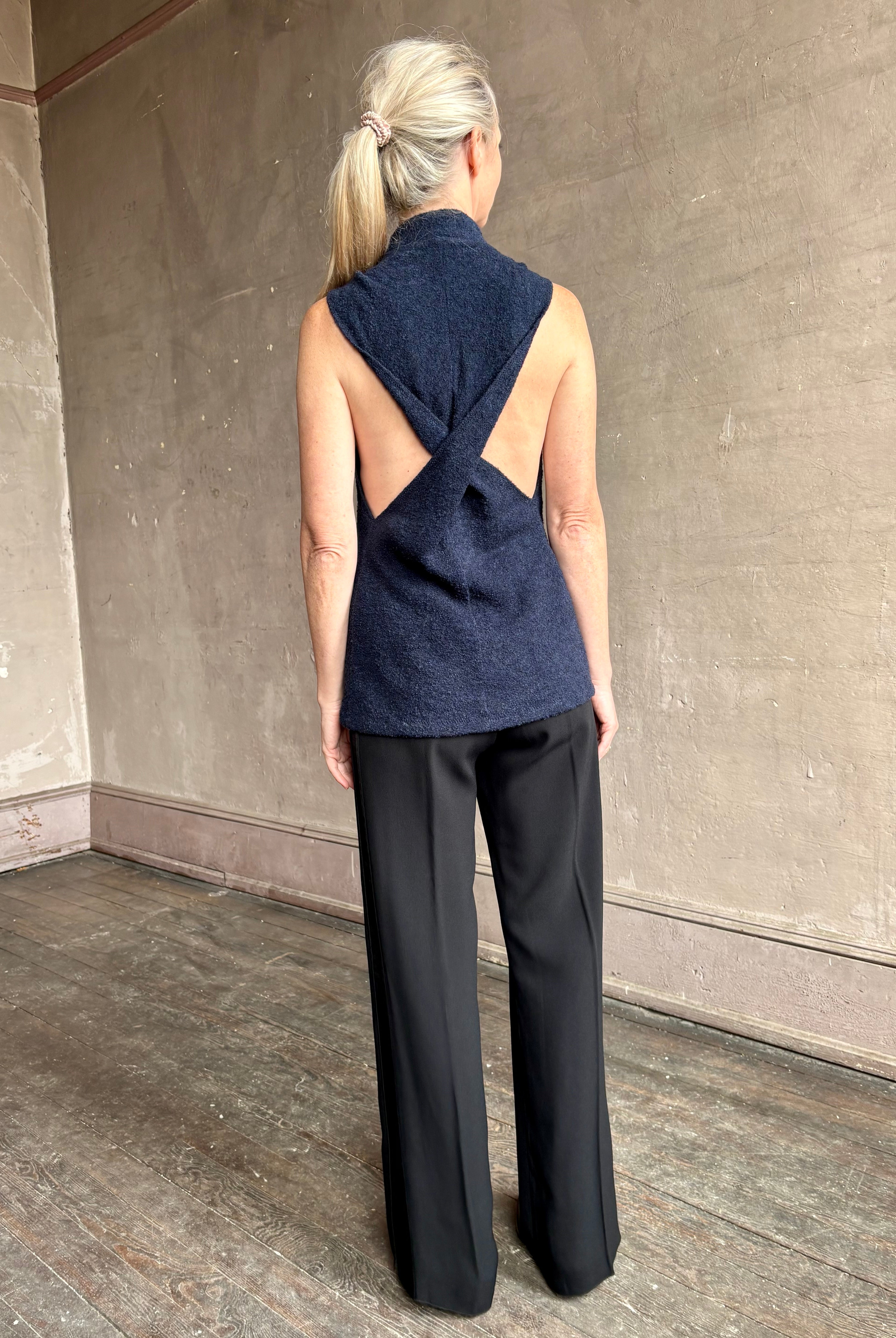 Image of mature woman wearing proenza schouler cynthia sleeveless top in a boucle texture and a beautifully designed back detailing