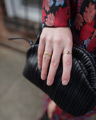 Image featuring fine jeweler Ananda Khalsa Large White Diamond 18k hammered matte Gold Side Trios Ring in premium handcrafted construction