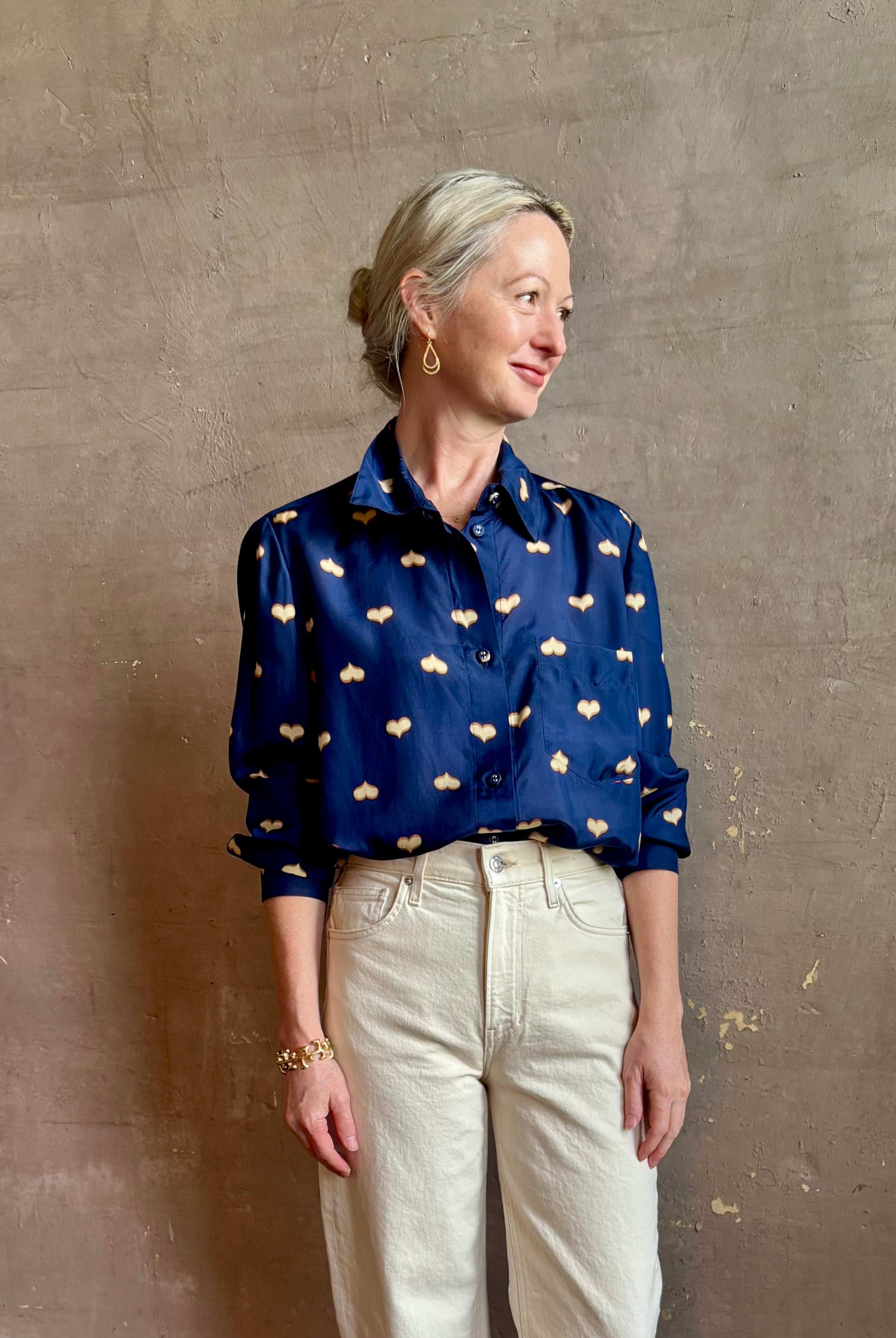 mature woman wearing designer Rachel Comey navy silk Lilo button down long sleeve contemporary heart print