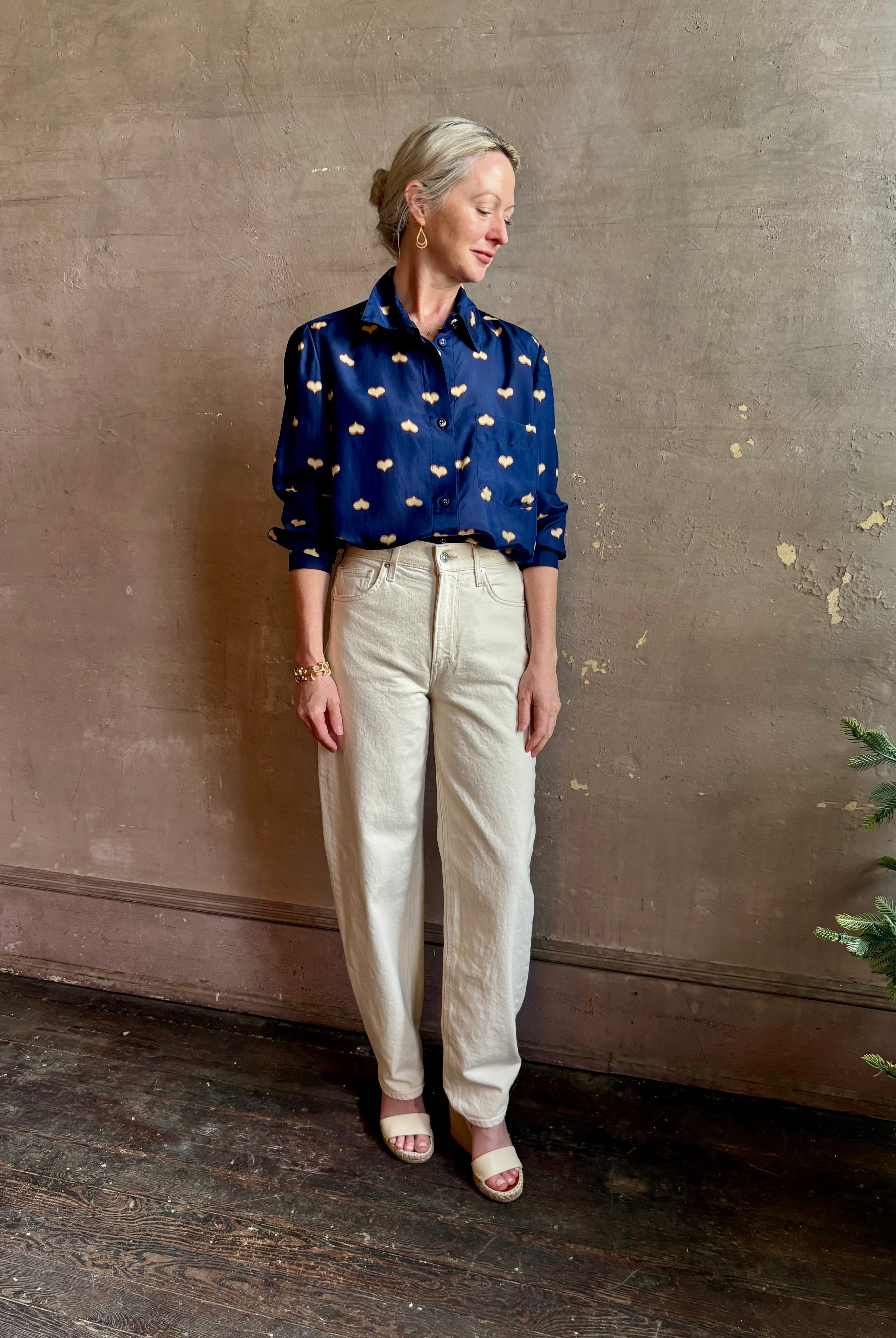 mature woman wearing designer Rachel Comey navy silk Lilo button down long sleeve contemporary heart print