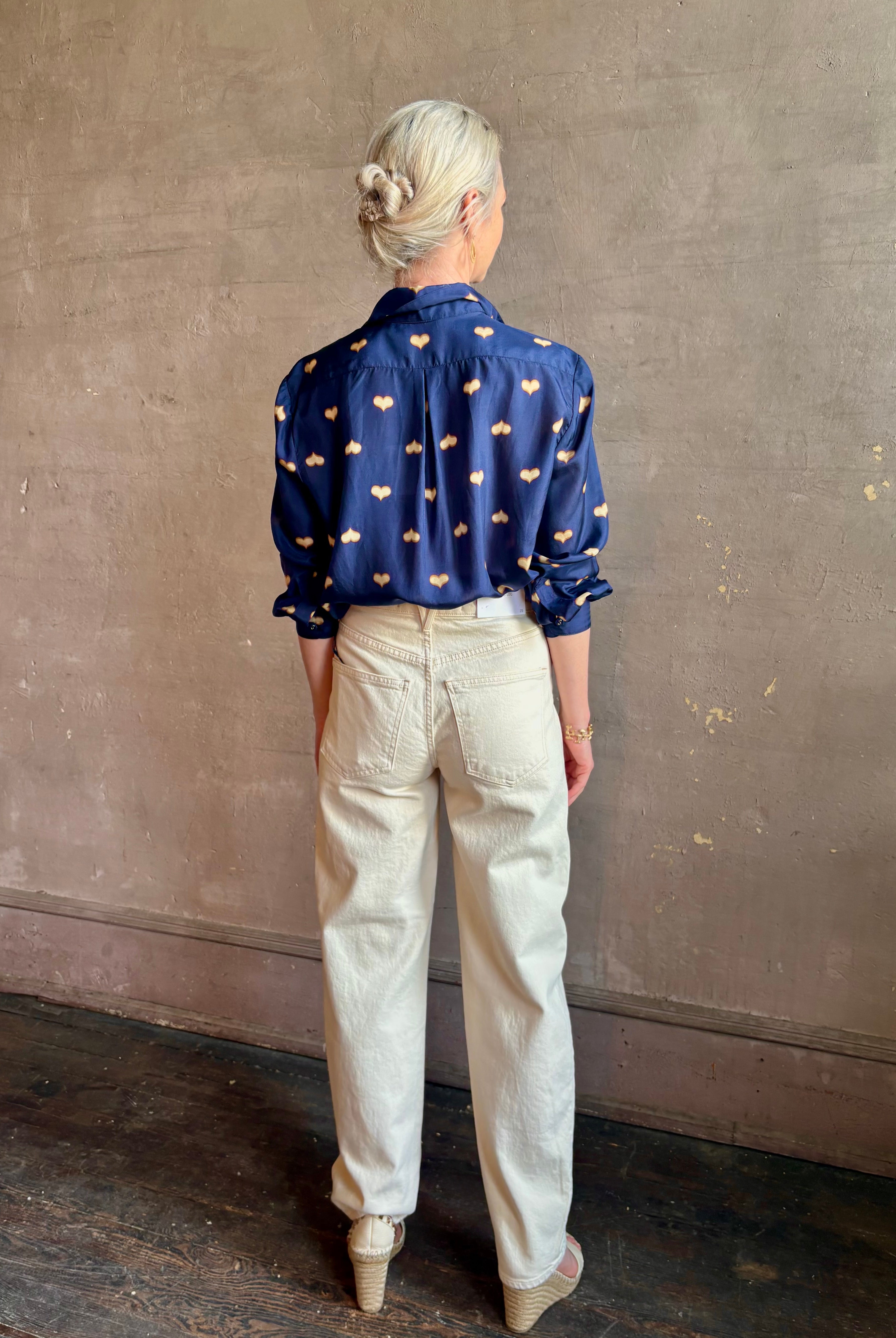 mature woman wearing designer Rachel Comey navy silk Lilo button down long sleeve contemporary heart print