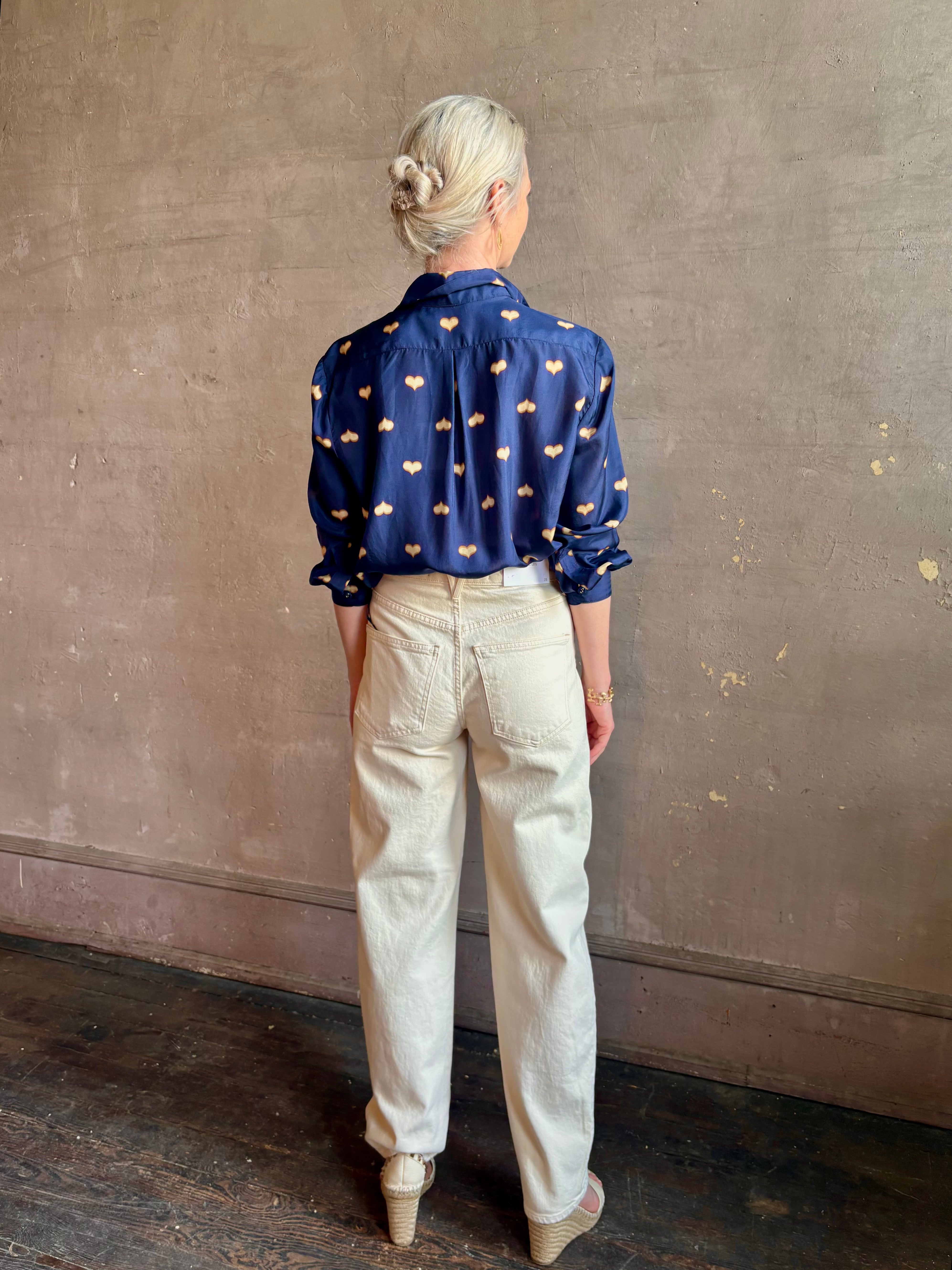 mature woman wearing designer Rachel Comey navy silk Lilo button down long sleeve contemporary heart print