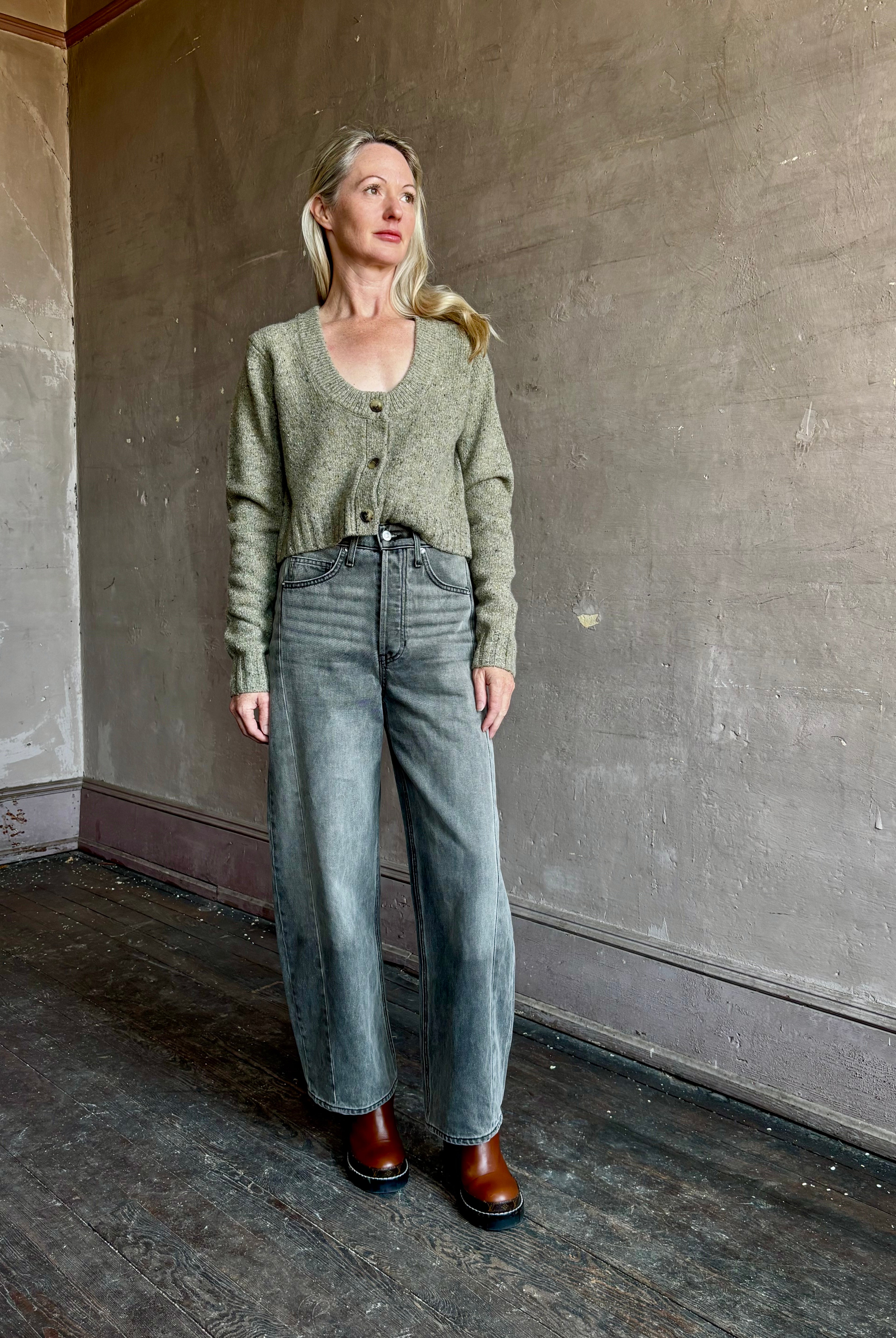 Image of mature woman wearing American designer Rachel Comey Uridge Cardigan in sophisticated green with a flattering U-neckline
