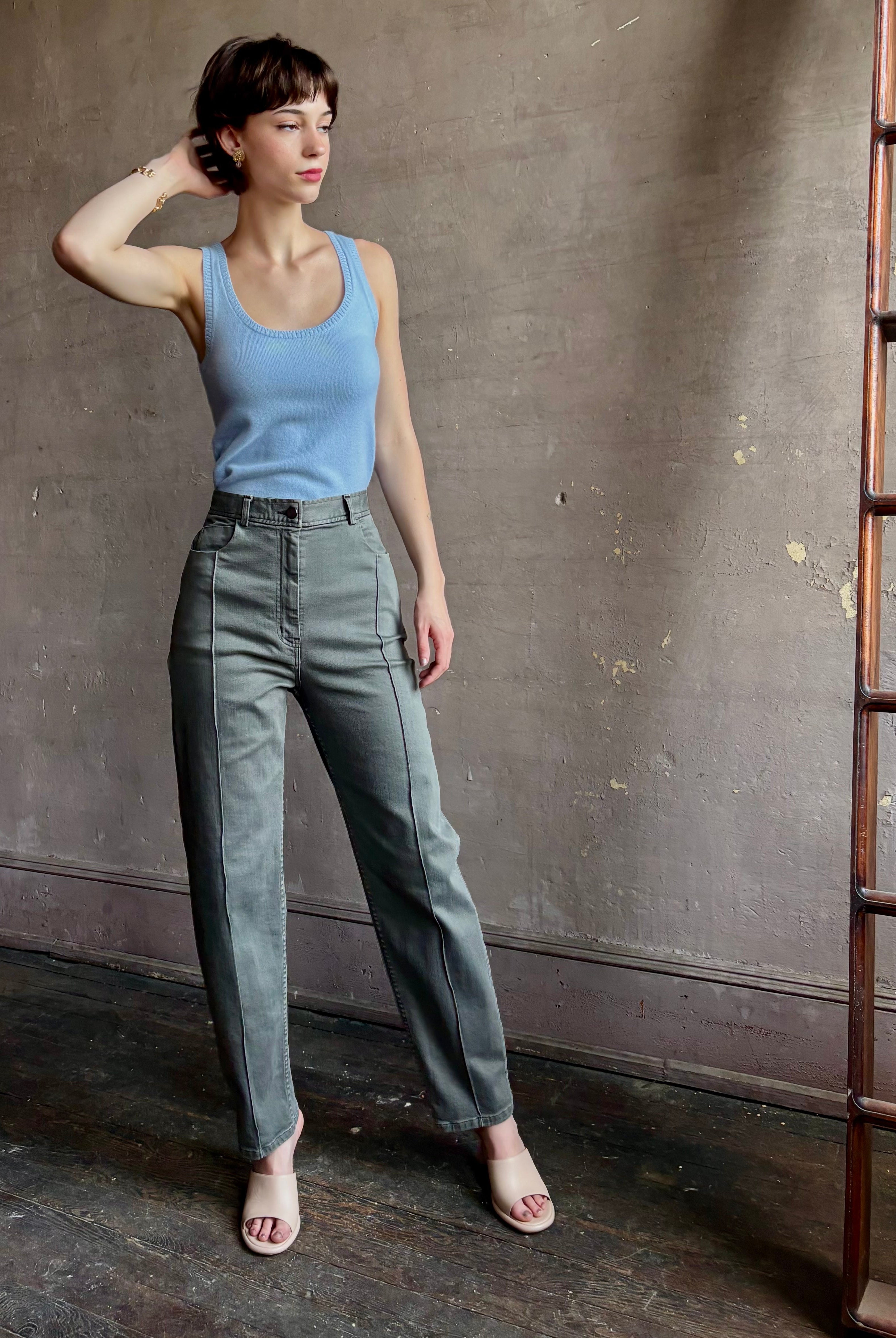 Woman wearing designer Rachel Comey Dardo green stretch cotton Pant high rise pintuck front seam Alaia back