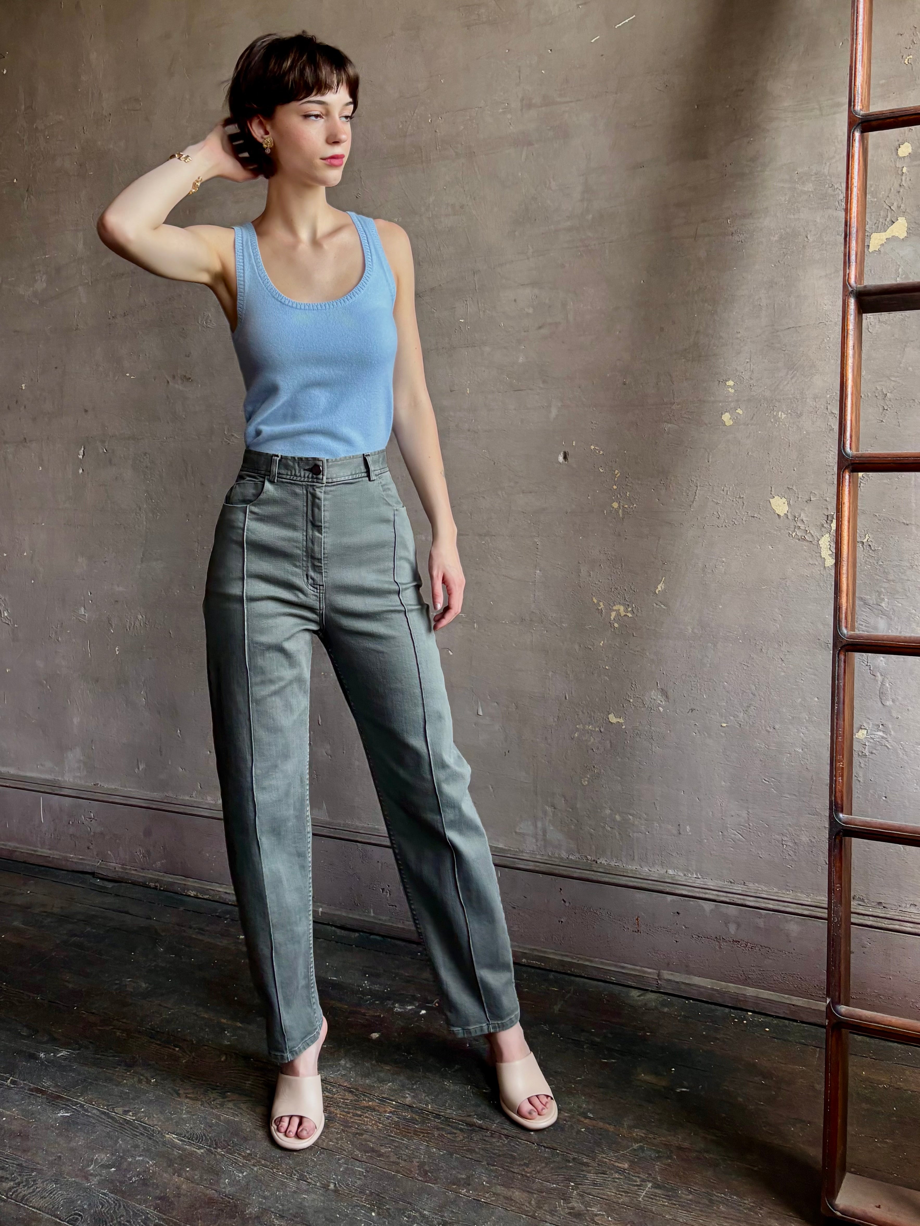 Woman wearing designer Rachel Comey Dardo green stretch cotton Pant high rise pintuck front seam Alaia back