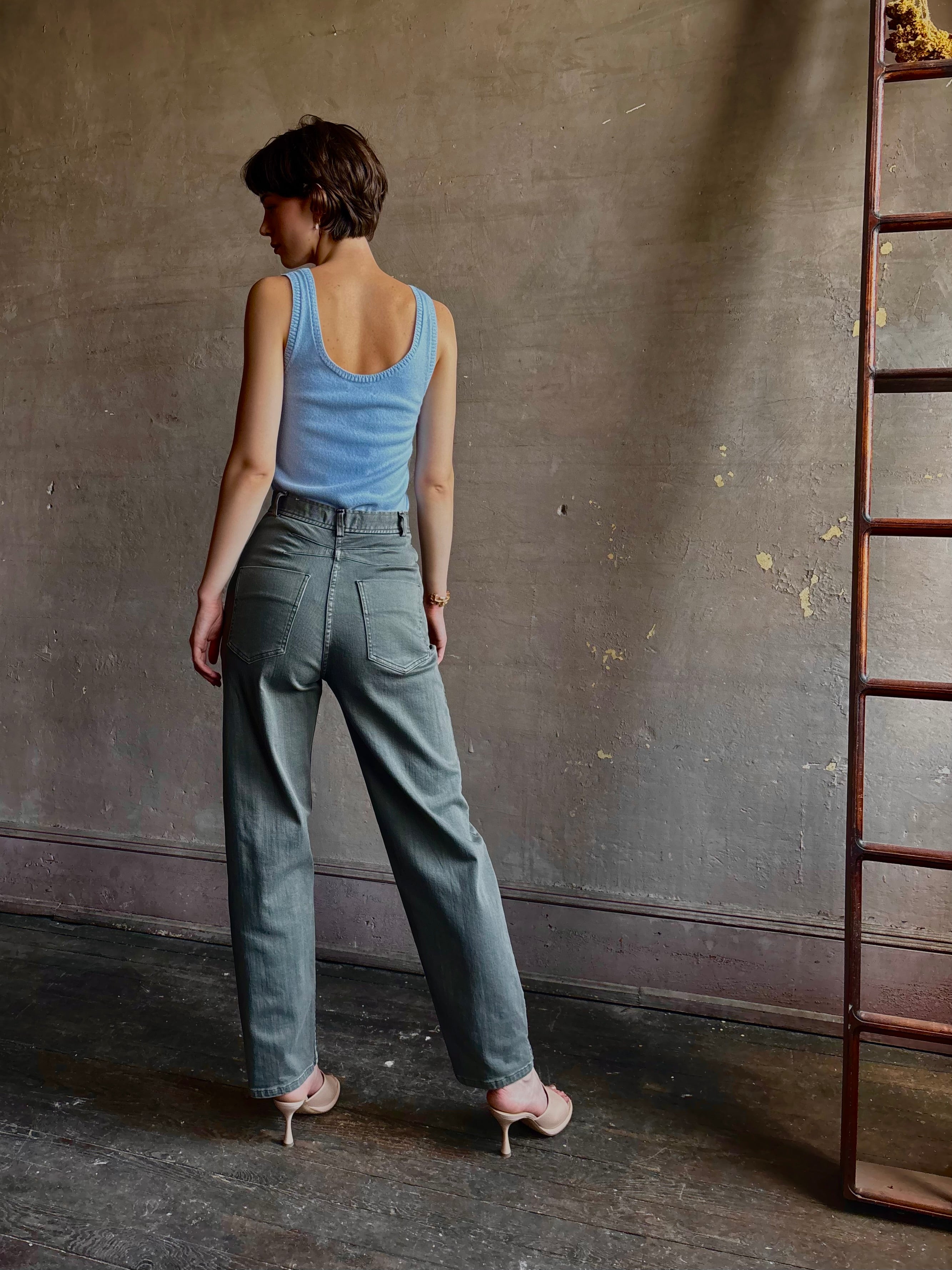 Woman wearing designer Rachel Comey Dardo green stretch cotton Pant intricate back detail similar to Alaia