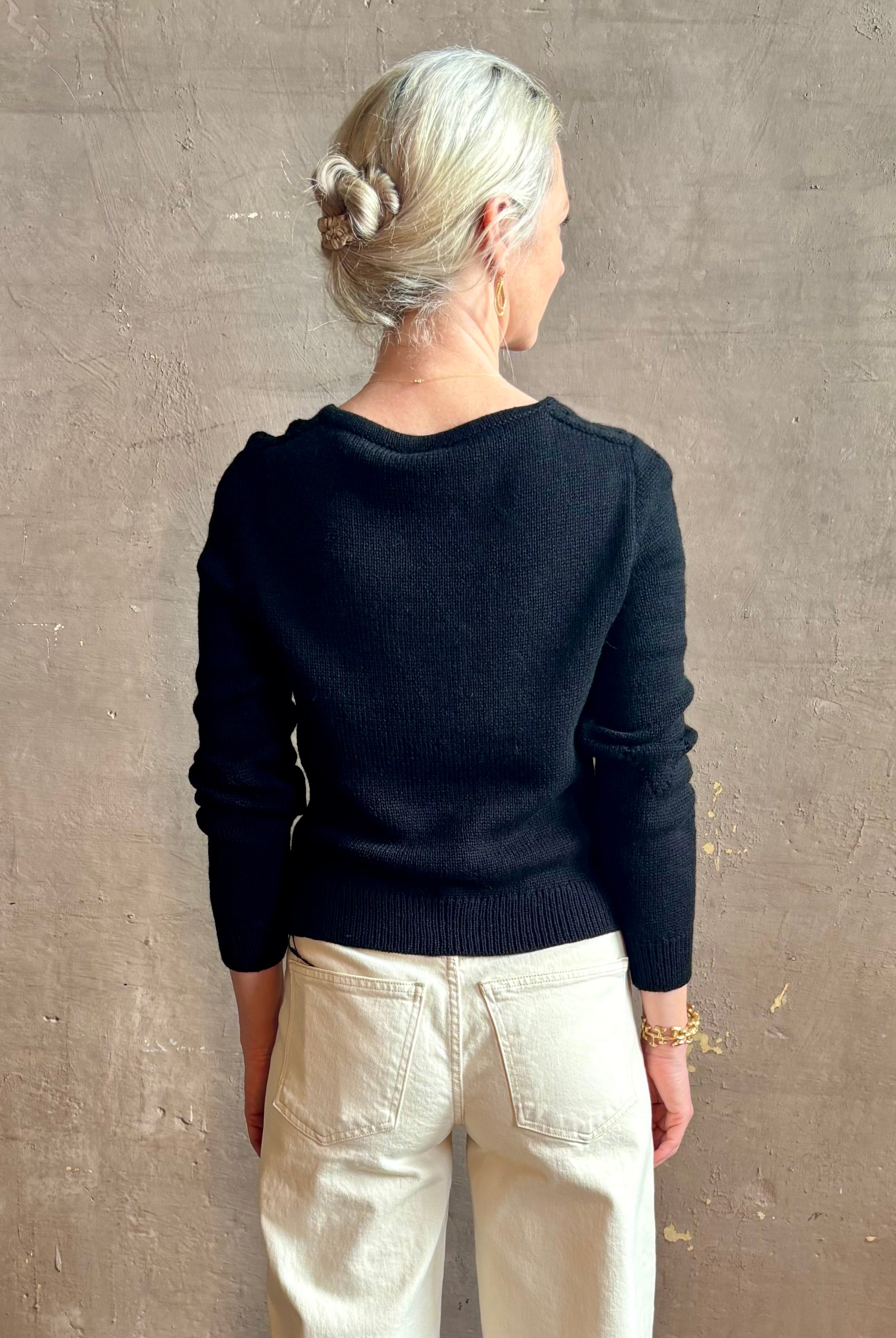 Mature woman wearing designer rachel comey Etla knit top with long sleeves sweetheart neckline in timeless black