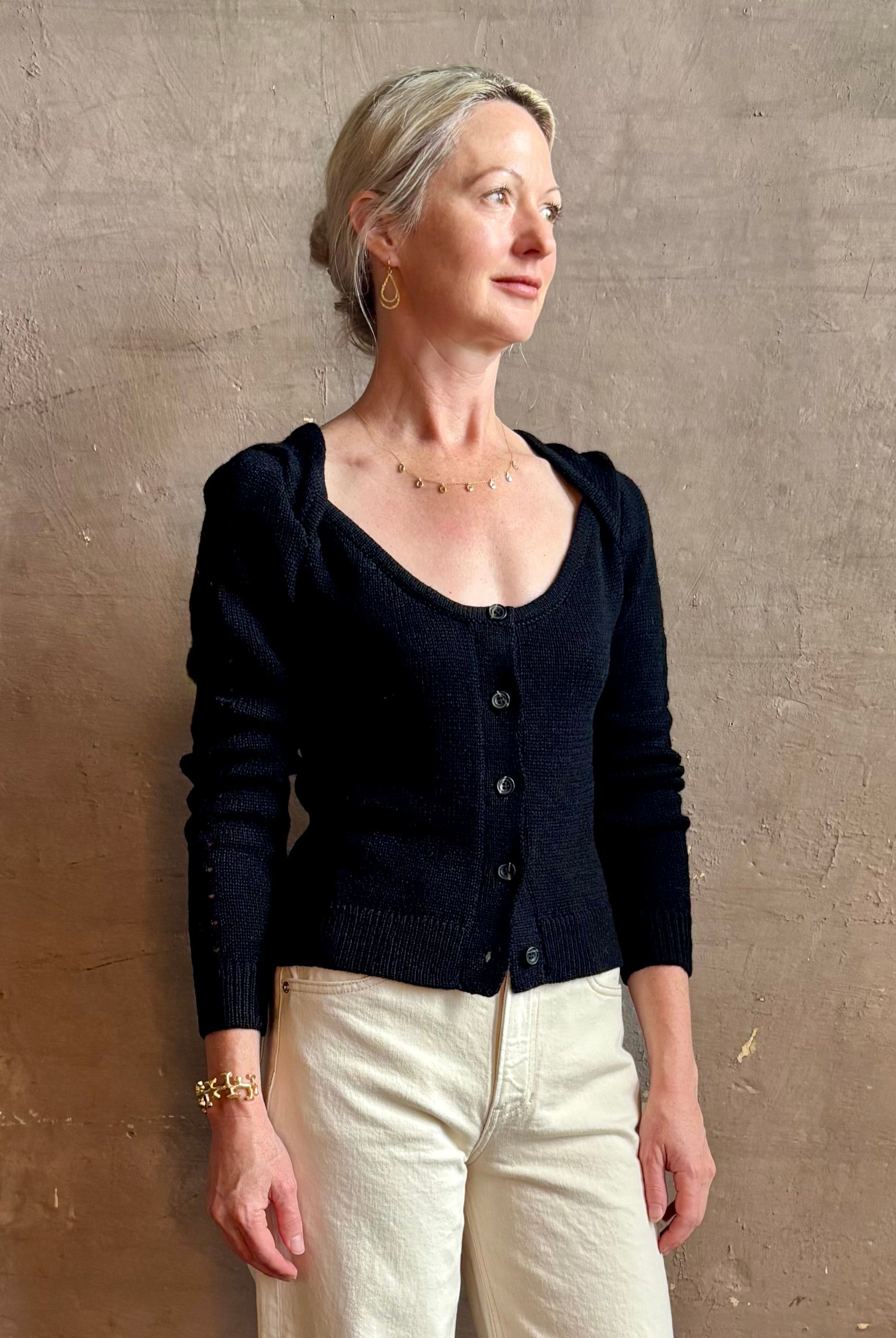Mature woman wearing designer rachel comey Etla knit top with long sleeves sweetheart neckline in timeless black