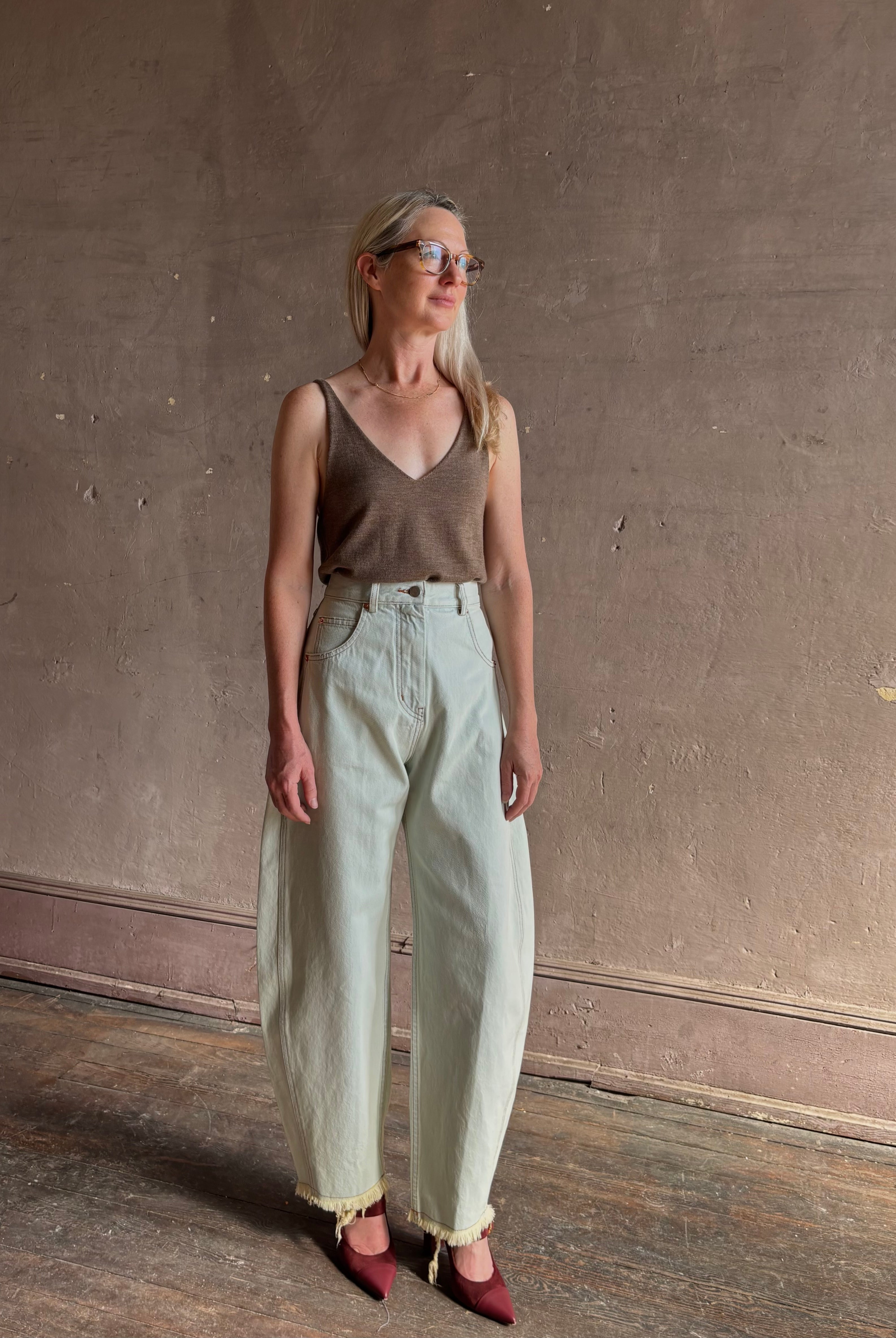 Mature woman wearing Rachel Comey barrel leg Keenan rigid cotton denim pant sculptural designer jean made in USA
