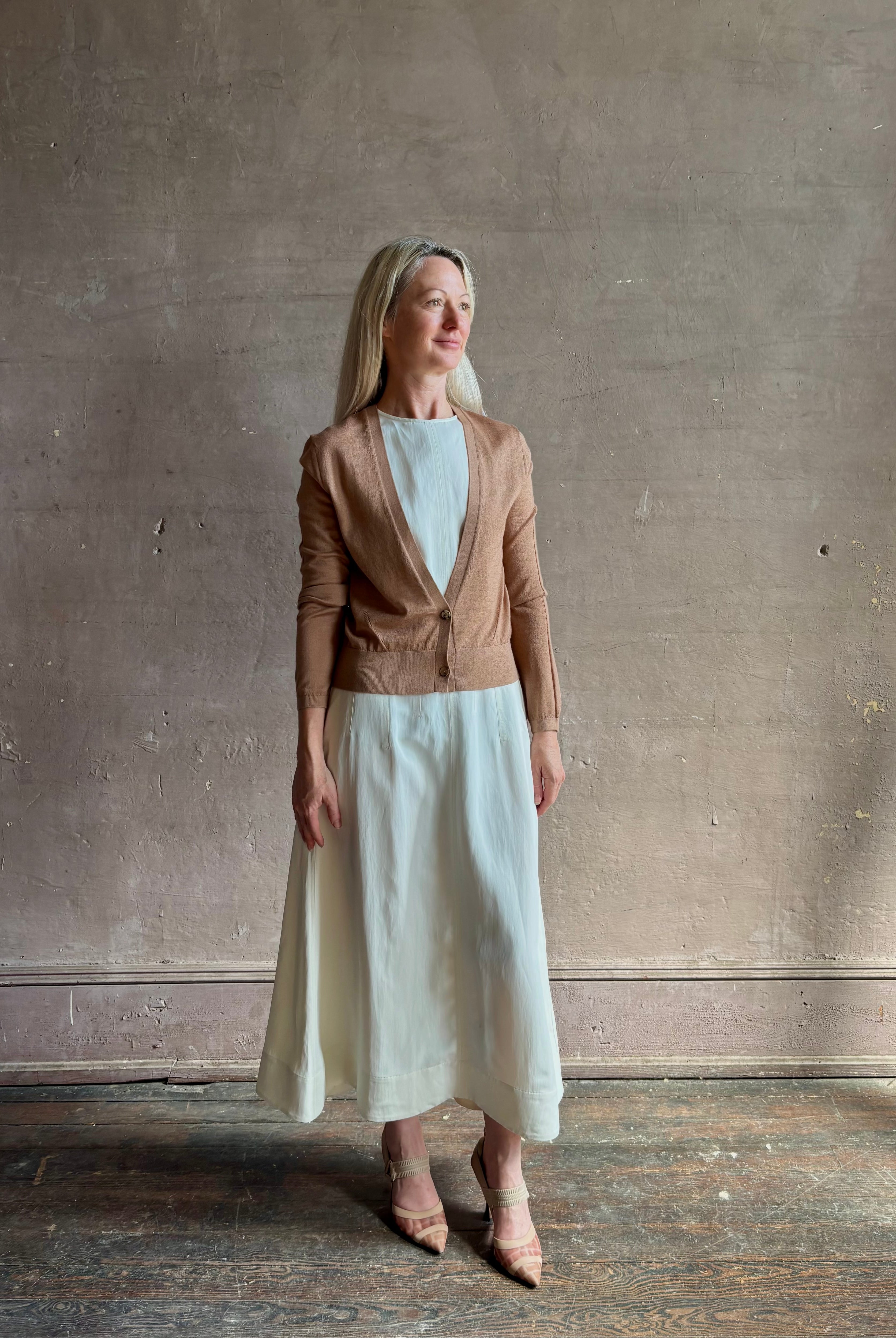 Mature woman wearing Rachel Comey long sleeve caramel cardigan leightweight plunging v-neck layering