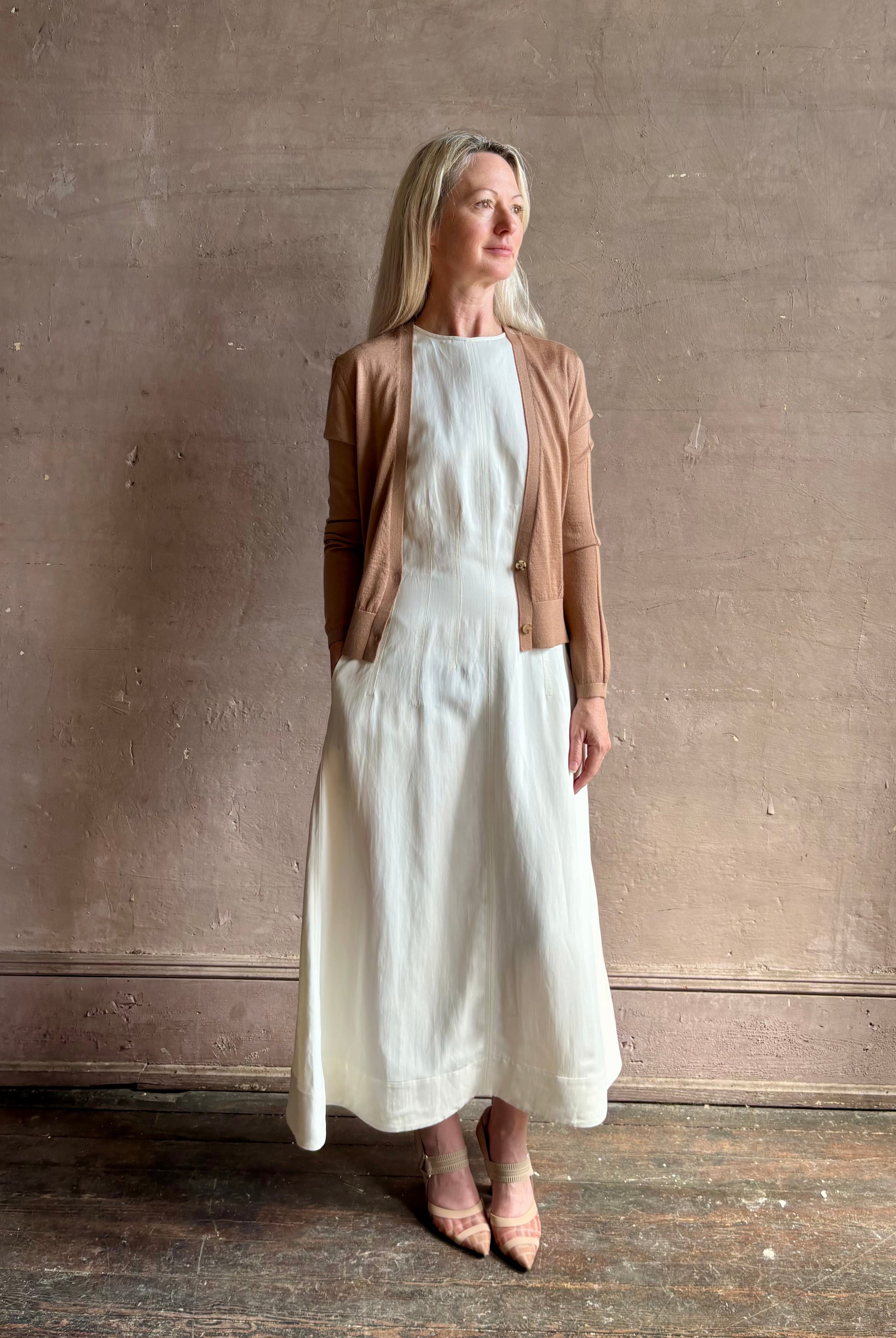 Mature woman wearing Rachel Comey long sleeve caramel cardigan leightweight plunging v-neck layering
