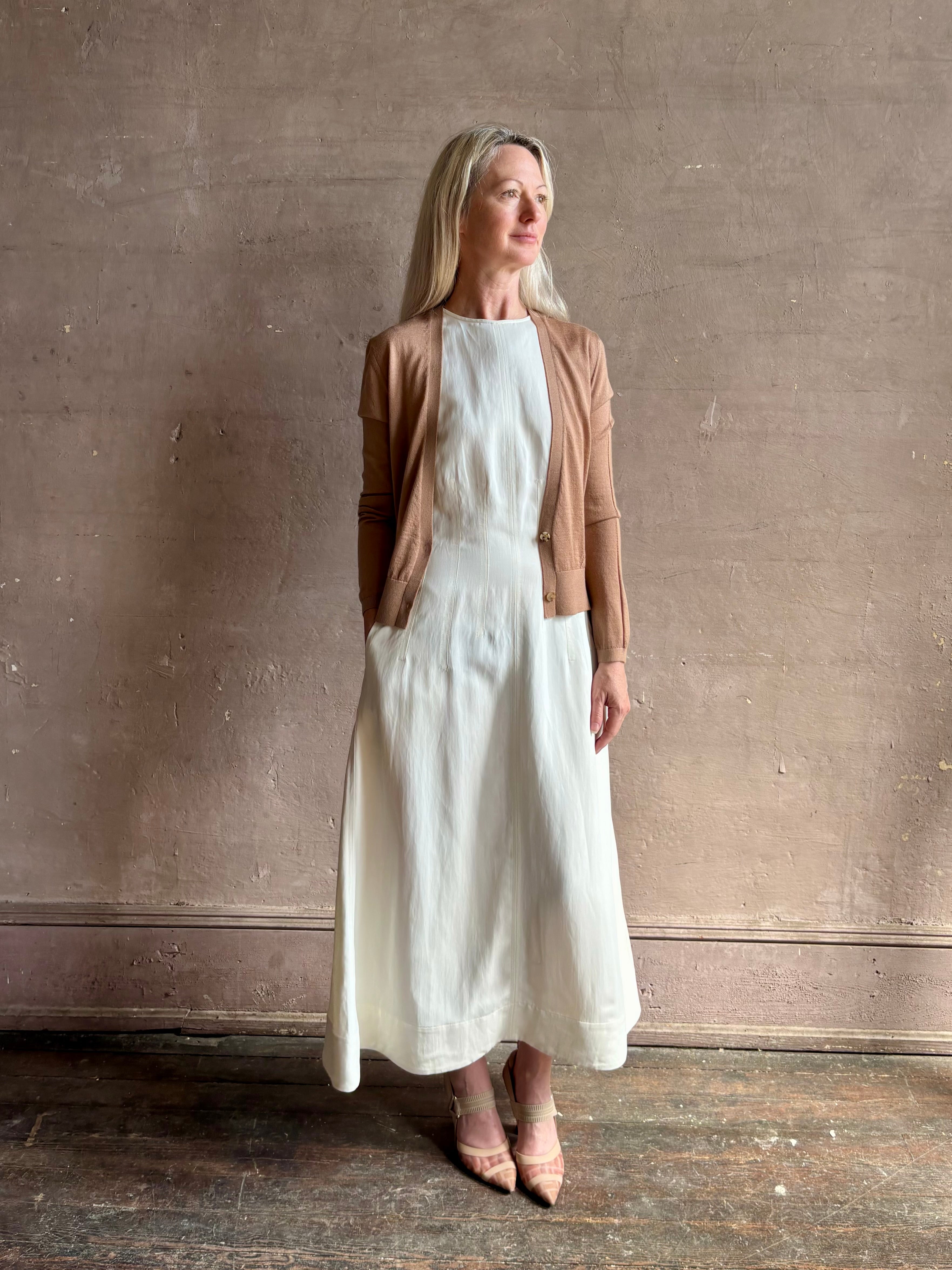 Mature woman wearing Rachel Comey long sleeve caramel cardigan leightweight plunging v-neck layering