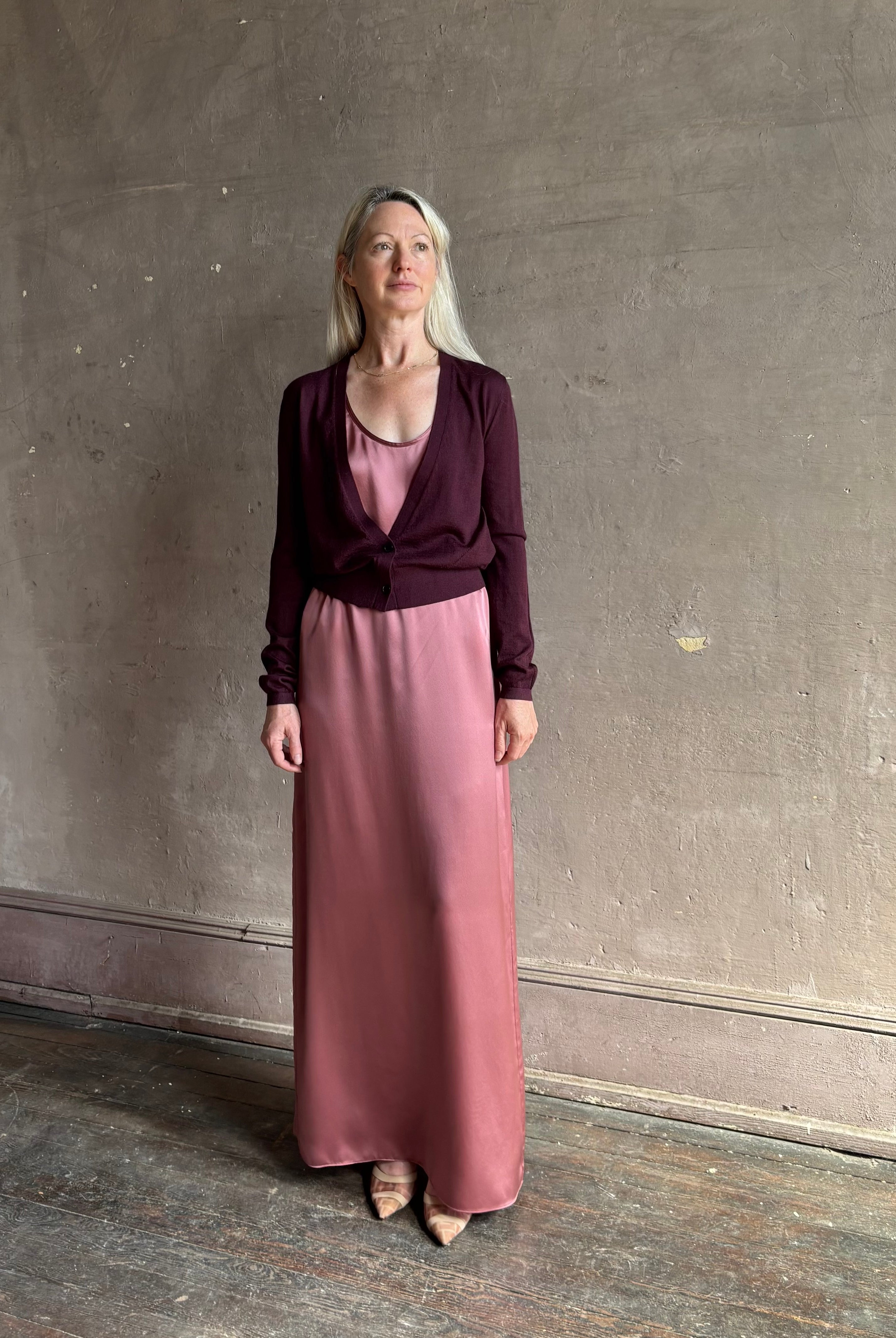 Mature woman wearing Rachel Comey long sleeve burgundy cardigan leightweight plunging v-neck layering