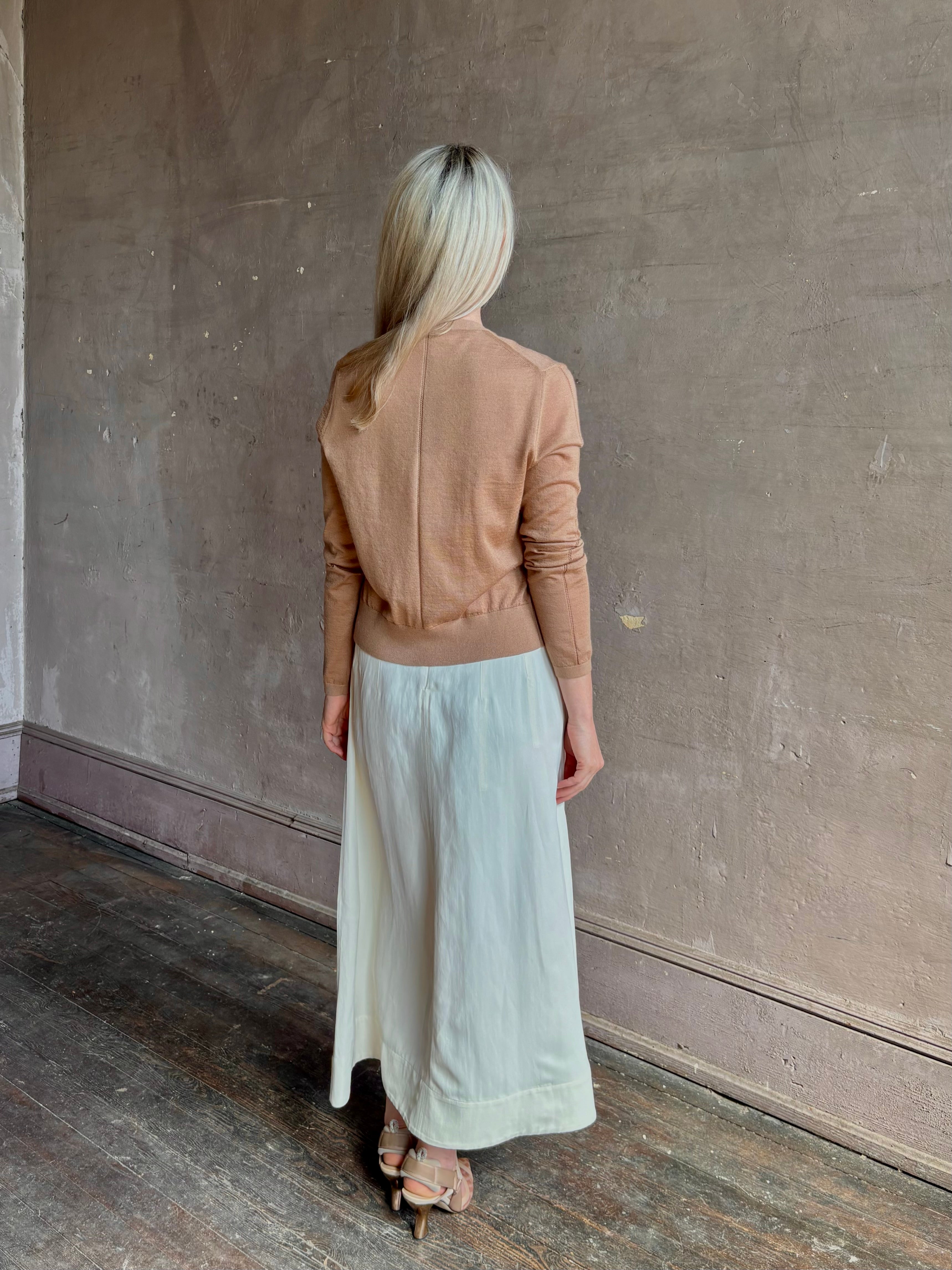 Mature woman wearing Rachel Comey long sleeve caramel cardigan leightweight plunging v-neck layering