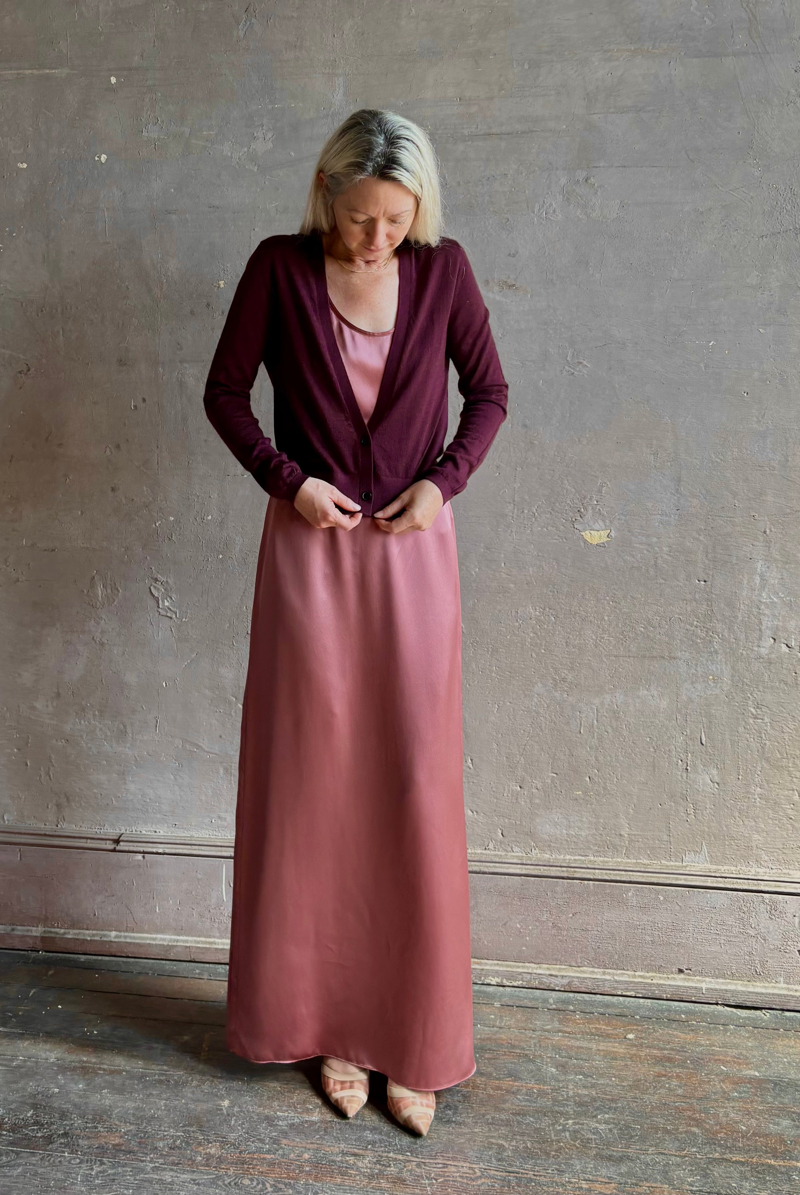 Mature woman wearing Rachel Comey long sleeve burgundy cardigan leightweight plunging v-neck layering