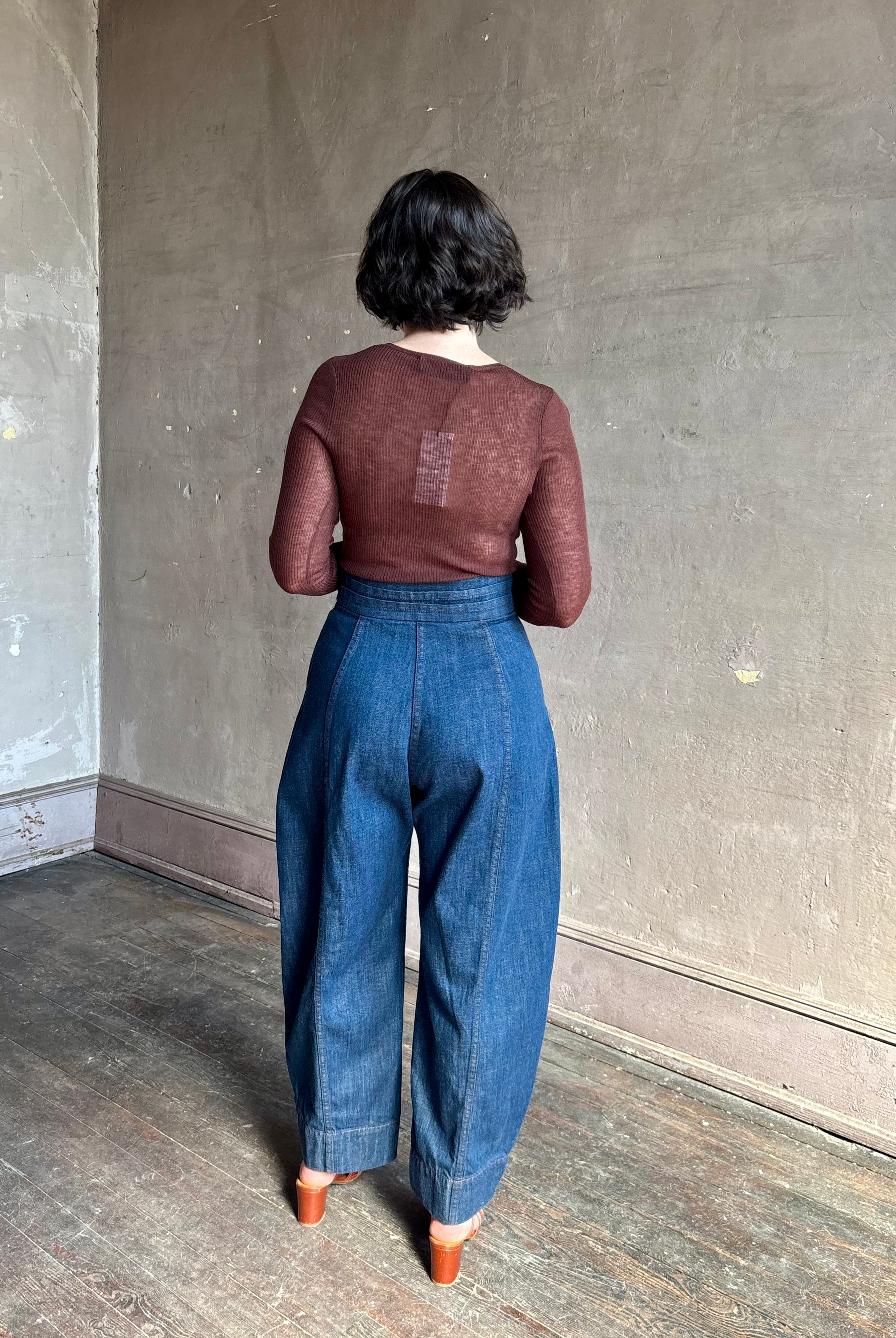 Rachel Comey sculptural high-rise dark wash denim with a built-in cummerbund-style waist barrel leg