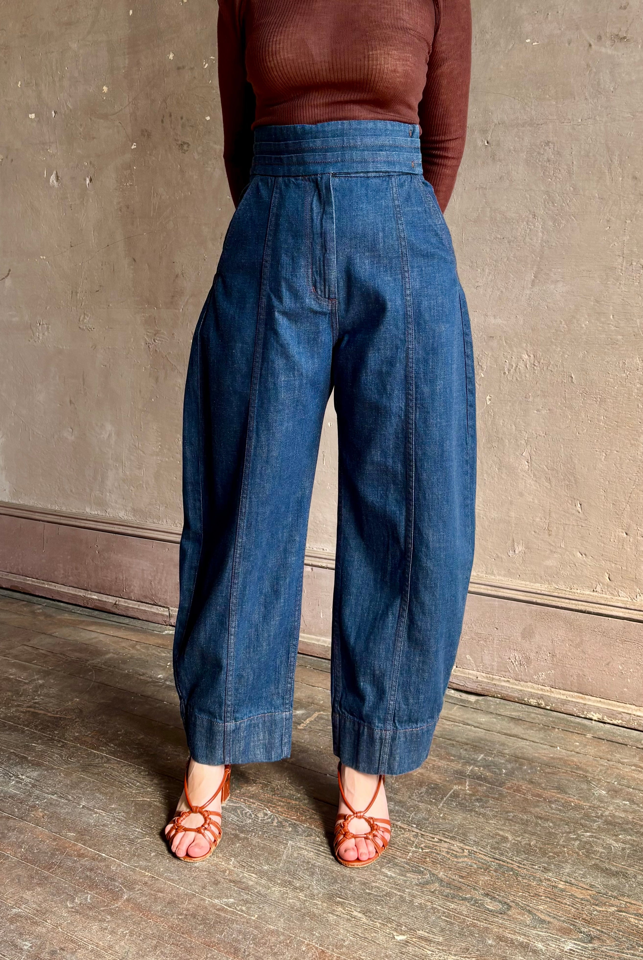 Rachel Comey sculptural high-rise dark wash denim with a built-in cummerbund-style waist barrel leg