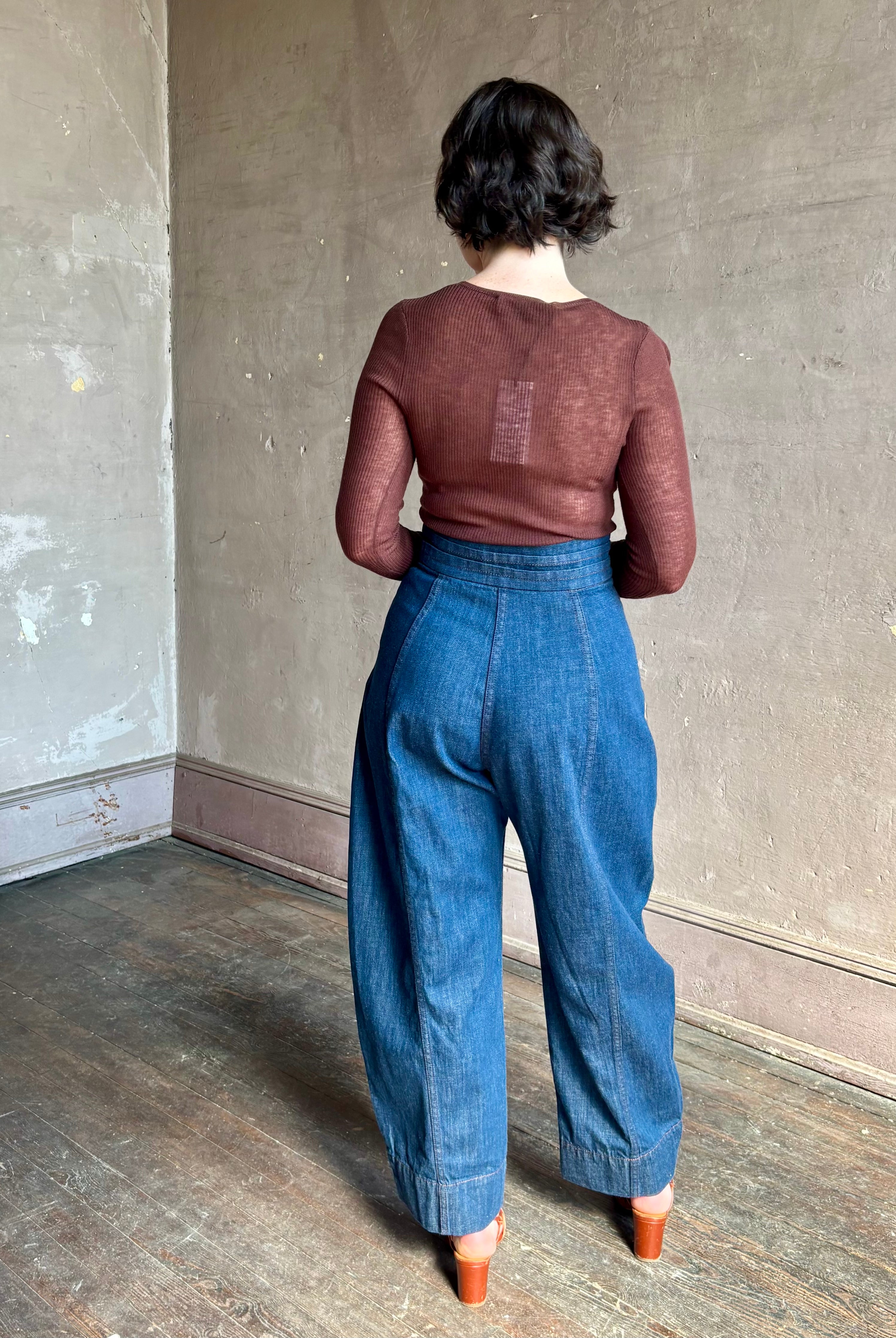 Rachel Comey sculptural high-rise dark wash denim with a built-in cummerbund-style waist barrel leg