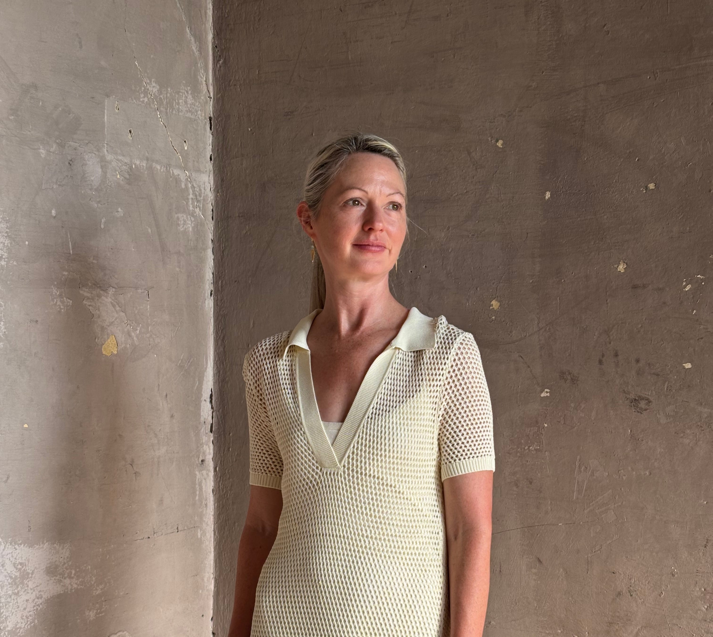 woman wearing Rag and bone Sheath cream maxi Dress open knit with slip slim-fit polo short sleeve side slits v-neck