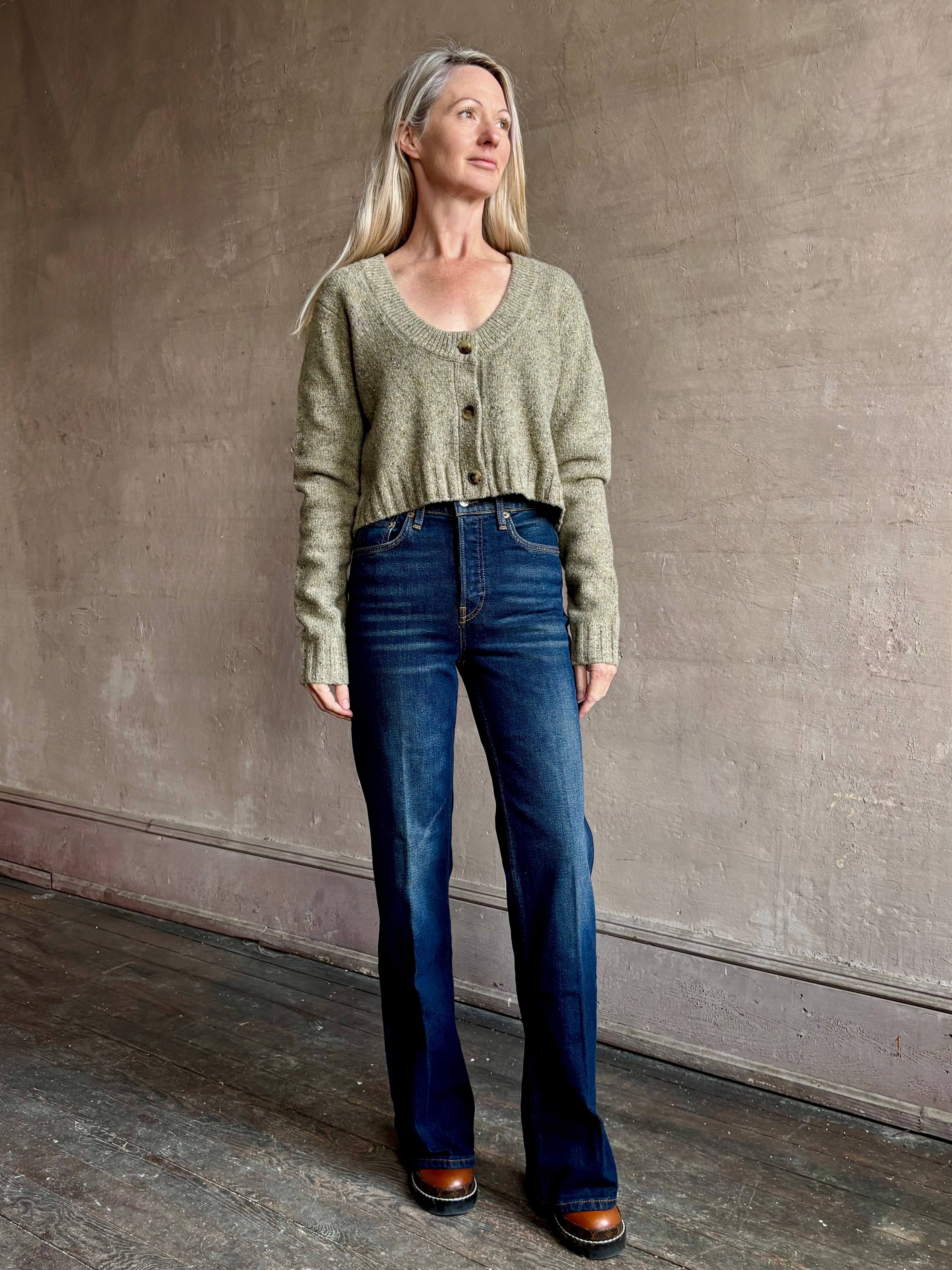 Woman wearing REDONE 70s Bootcut Denim in a dark blue wash with comfort stretch zip closure finished hem and 10.75" rise