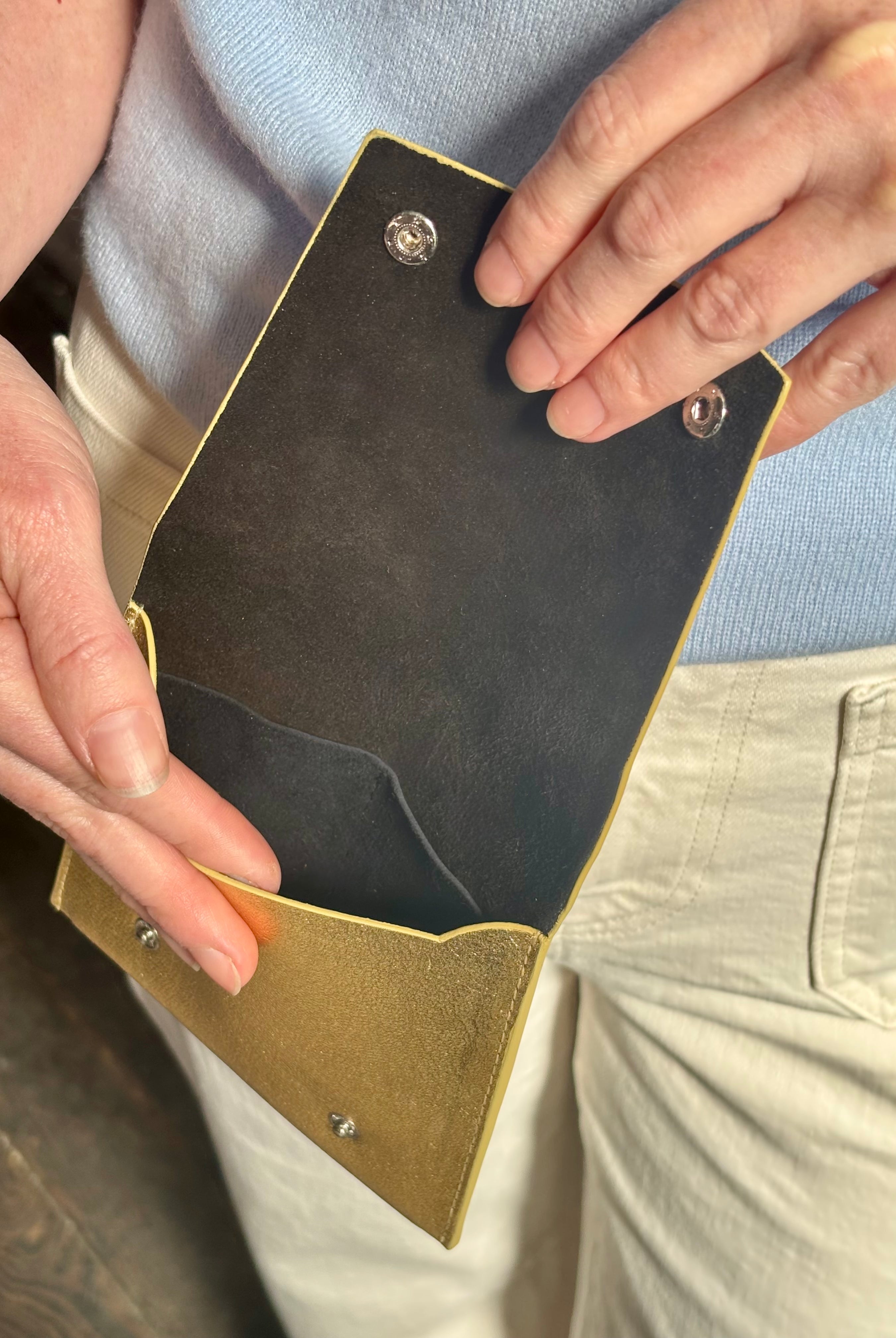 Metallic gold Rachel Comey leather wallet with two snap buttons closure