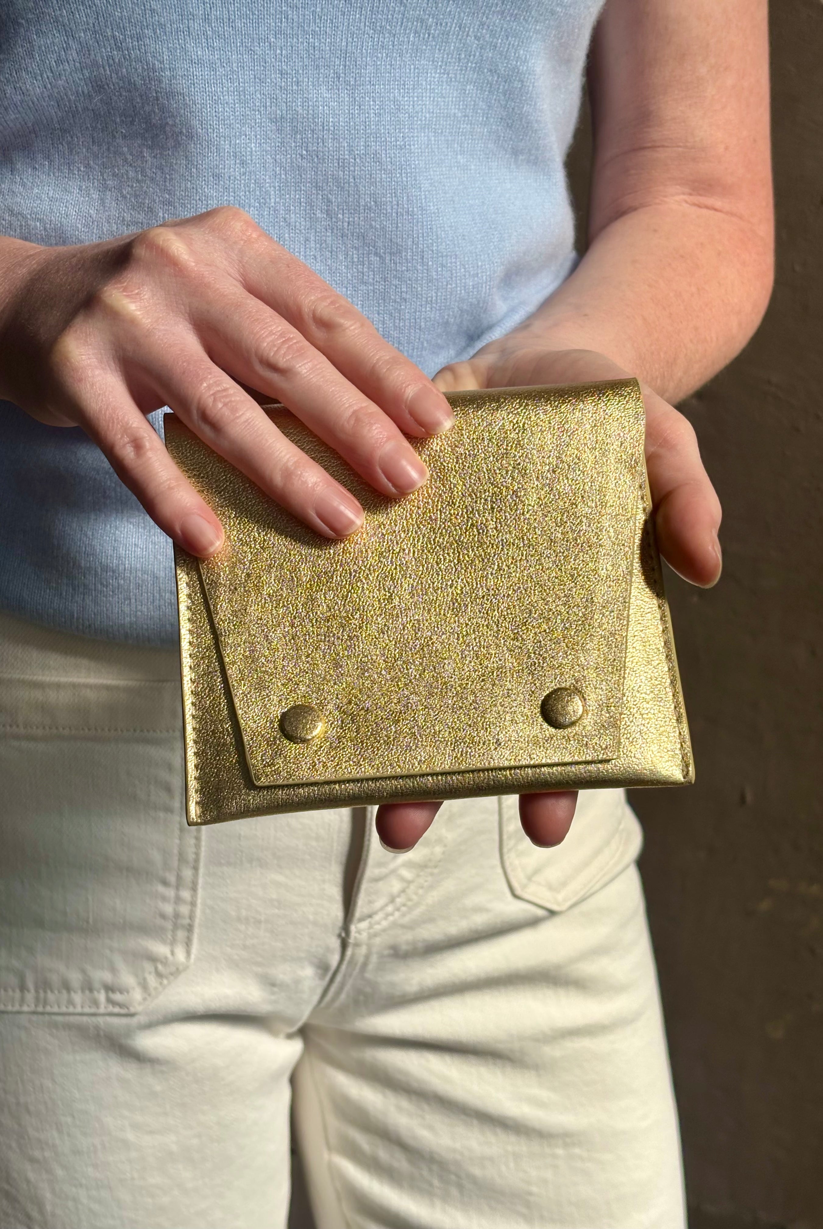 Metallic gold Rachel Comey leather wallet with two snap buttons closure
