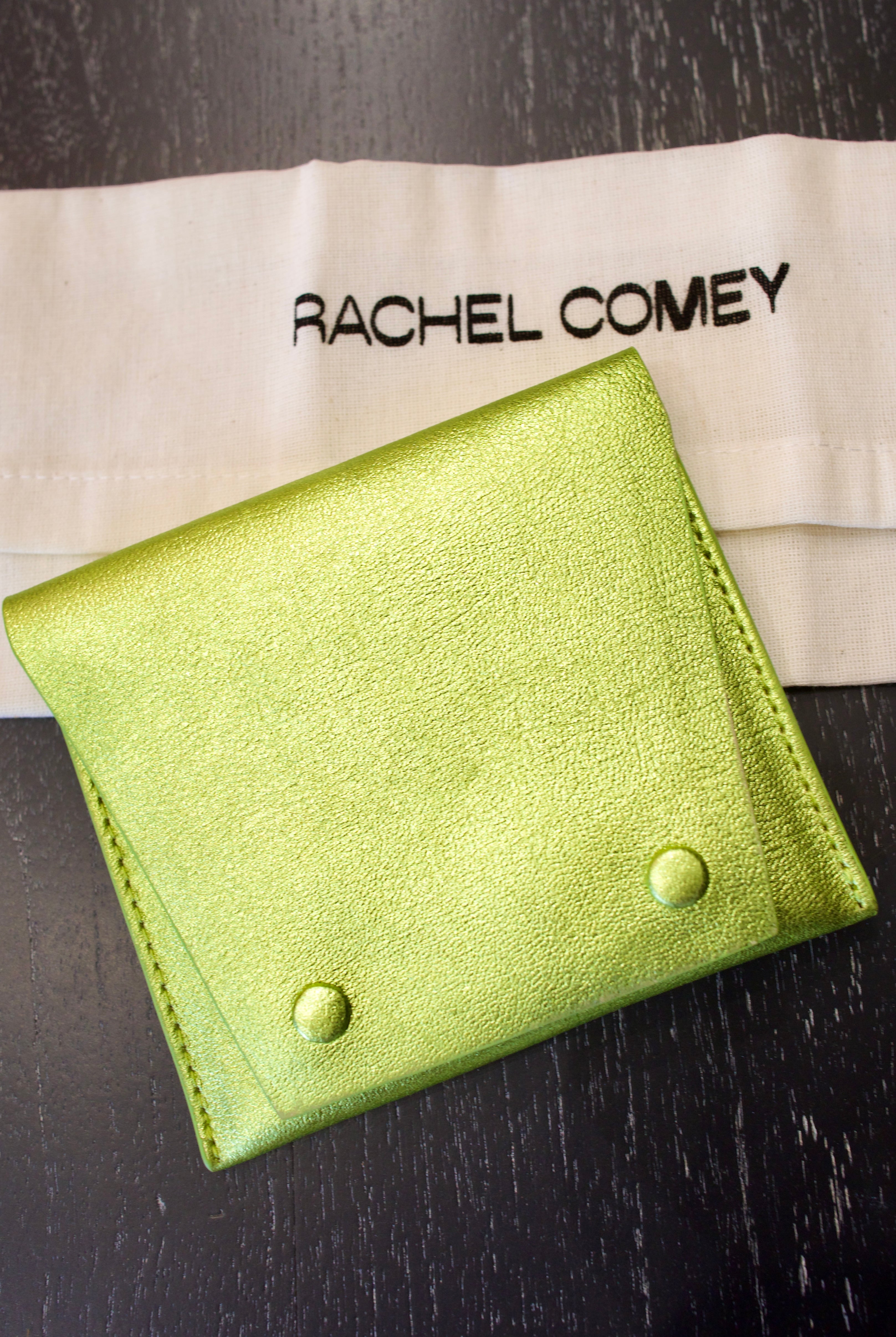 Green Rachel Comey leather wallet with two snap buttons closure