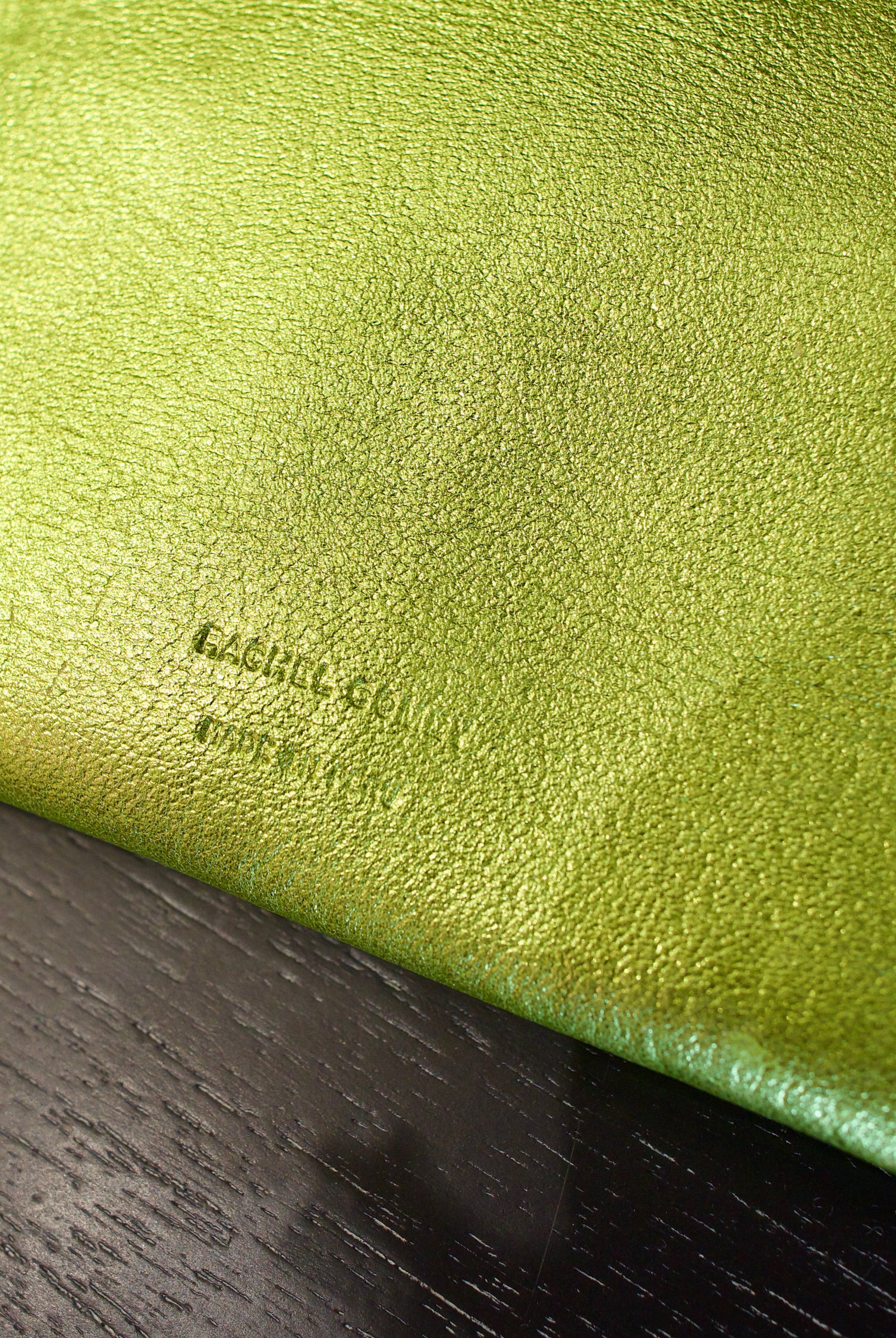 Lime green Rachel Comey leather wallet with two snap buttons closure