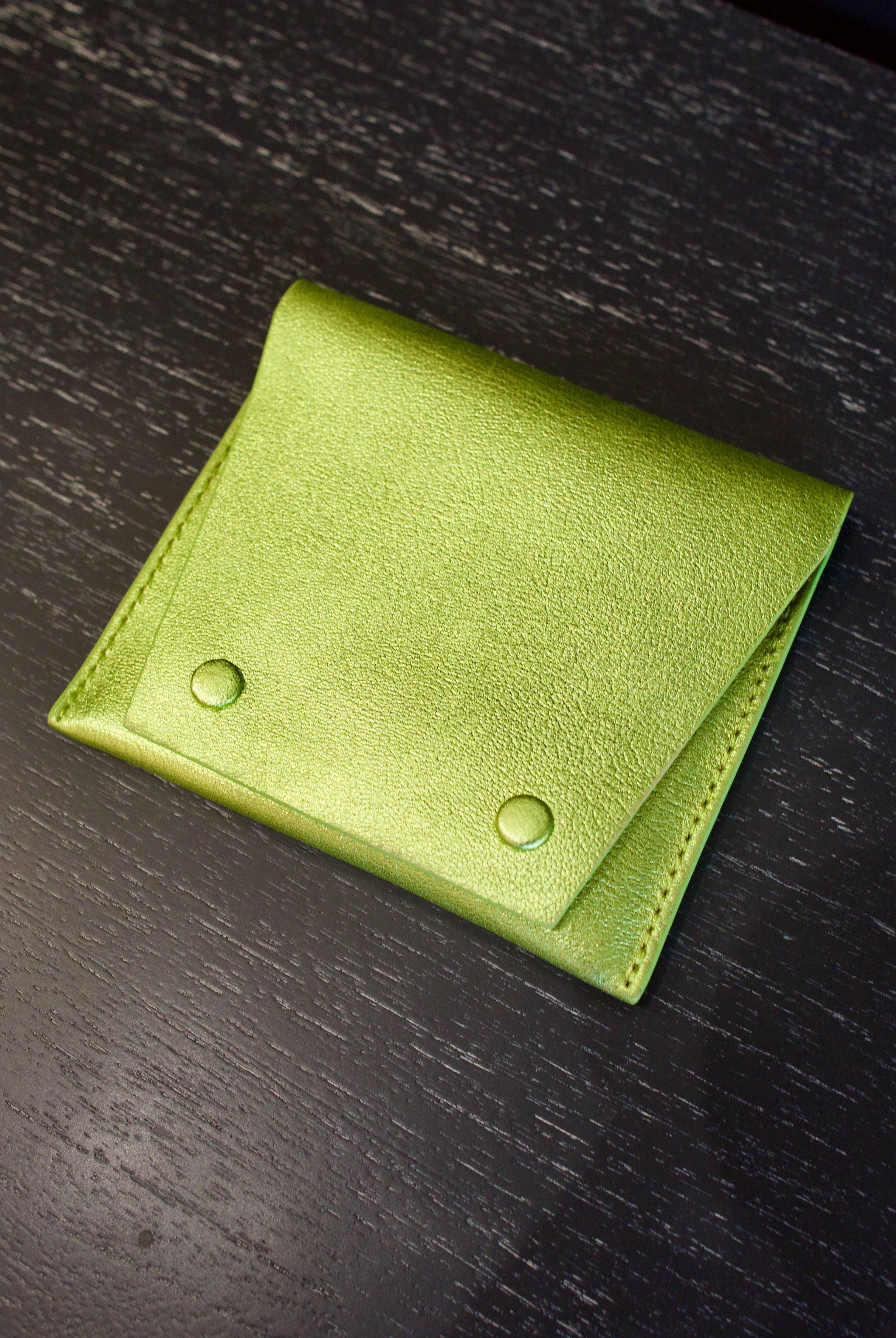 Lime green Rachel Comey leather wallet with two snap buttons closure