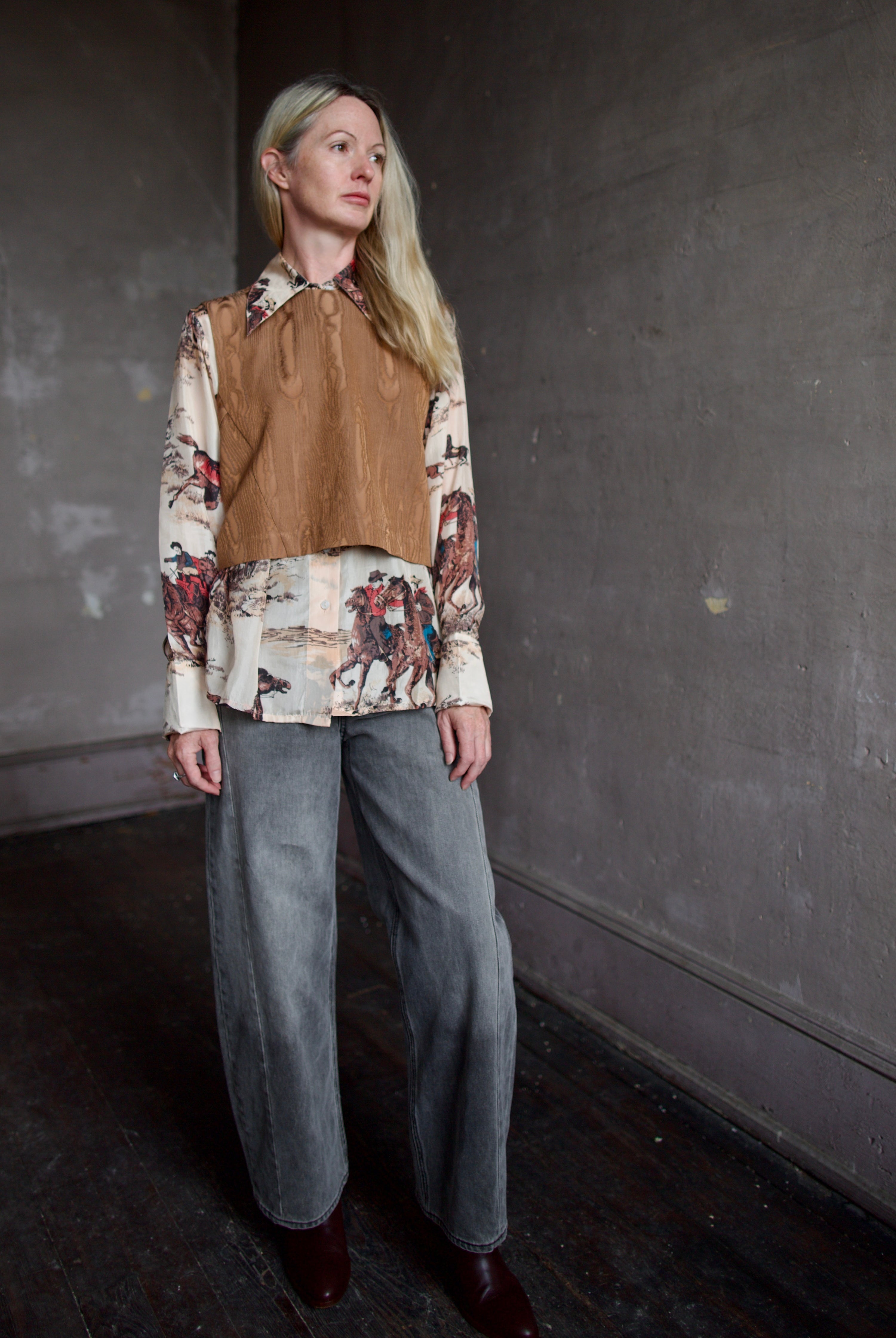 Model wearing a brown faux boise patterned top by designer Rachel Comey layered over a button down