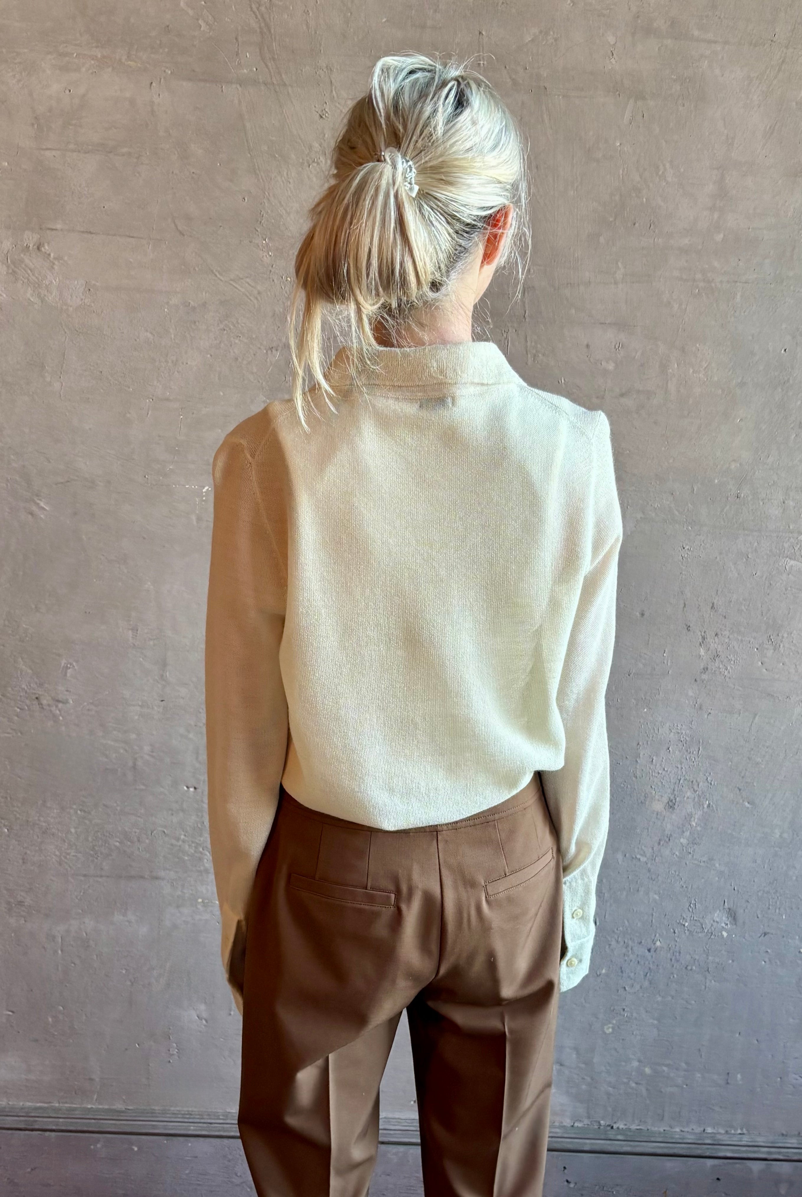 Image of woman wearing Premium Baby Alpaca Mulberry Silk Calma shirt by Rachel Comey with button front, long sleeves and button front in cream