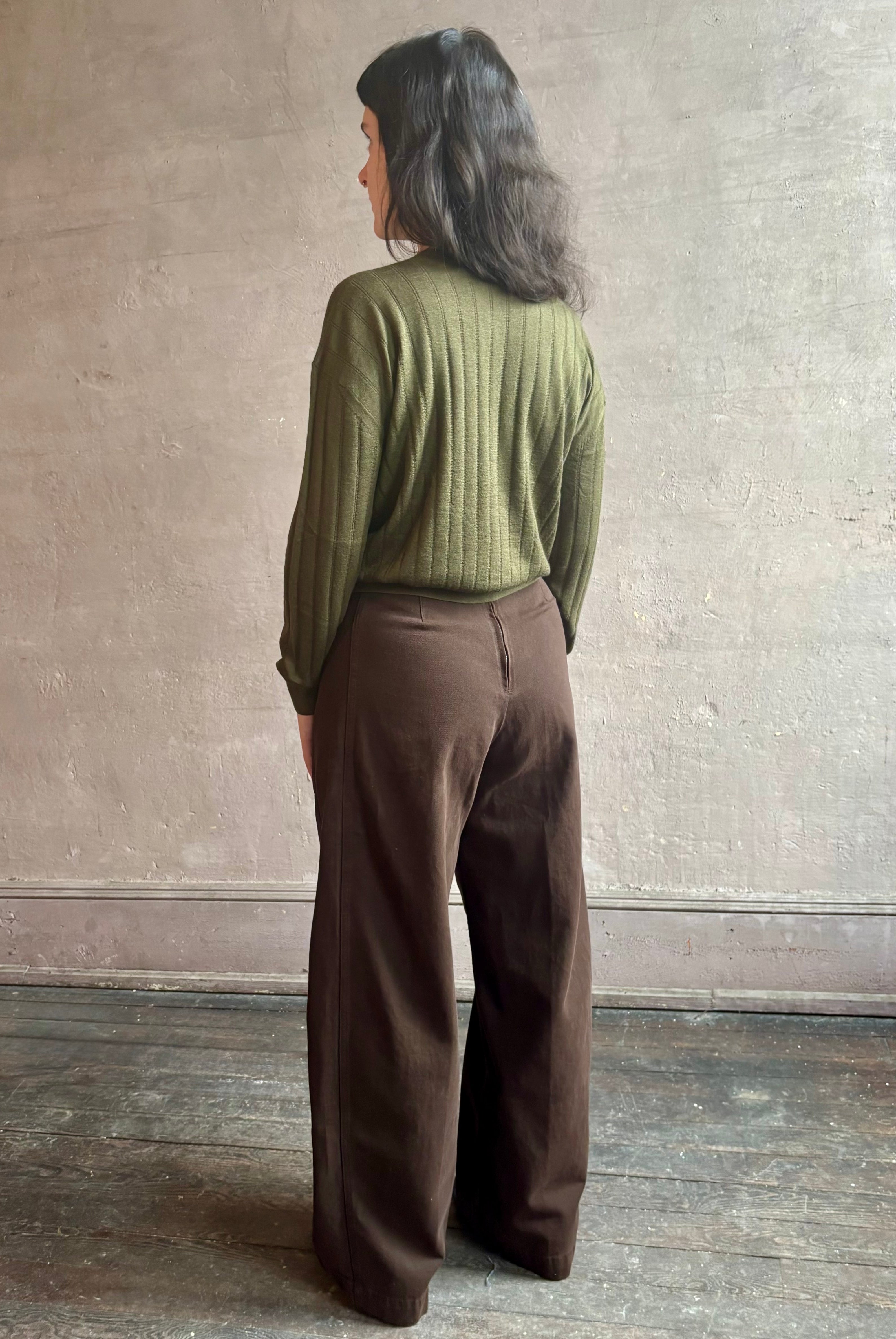 Image of woman wearing luxury Cashmere Silk Marion V-Neck designer Sweater by Rachel Comey in olive green with long sleeves and linear weave